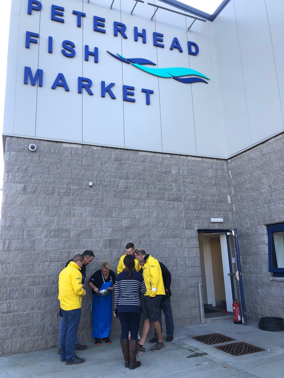Peterhead's crew outside the fish market
