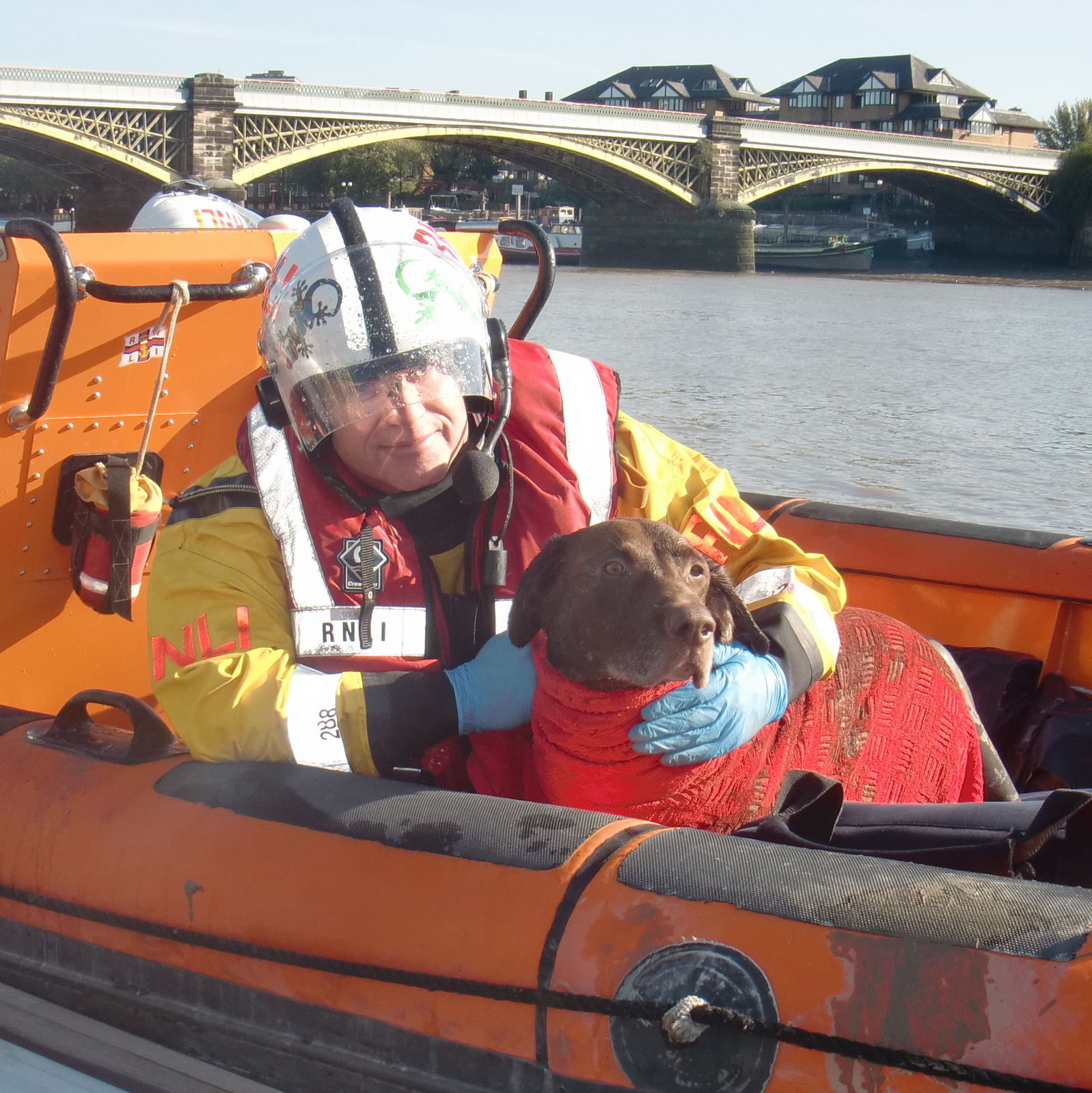 Mark Turrell with dog rescued by Chiswick Lifeboat