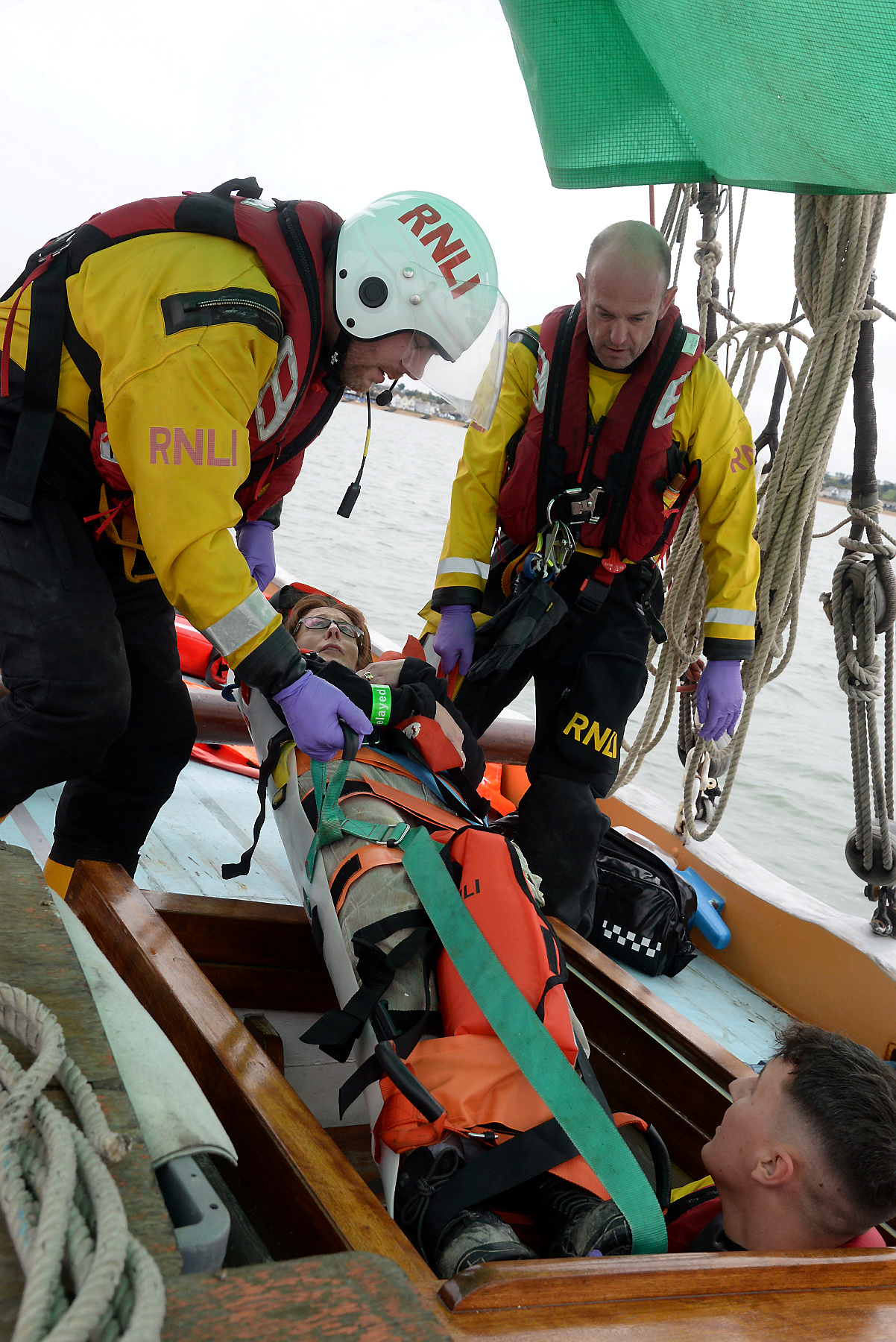 Joe Lovett, Adrian Woolrich-Burt and Liam Sidders extracate casualty Lindsay Hart from the lower deck during the 2019 Whitstable Lifeboat 'Dan Davies' first aid and seamanship exercise onboard the sailing barge Greta on Saturday. Picture:RNLI Whitstable.
