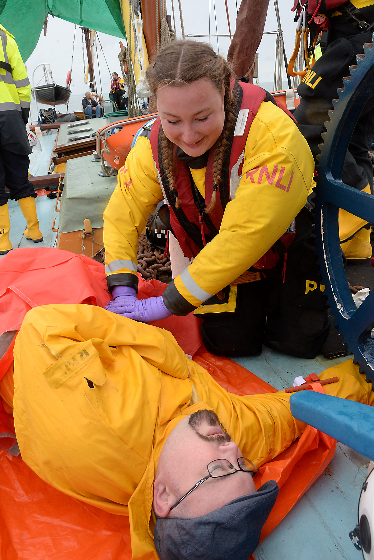 Ruth Oliver administers first aid to casualty Scott Goudie during the Whitstable Lifeboat 'Dan Davies' first aid and seamanship exercise onboard the sailing barge Greta on Saturday. Picture:RNLI Whitstable.