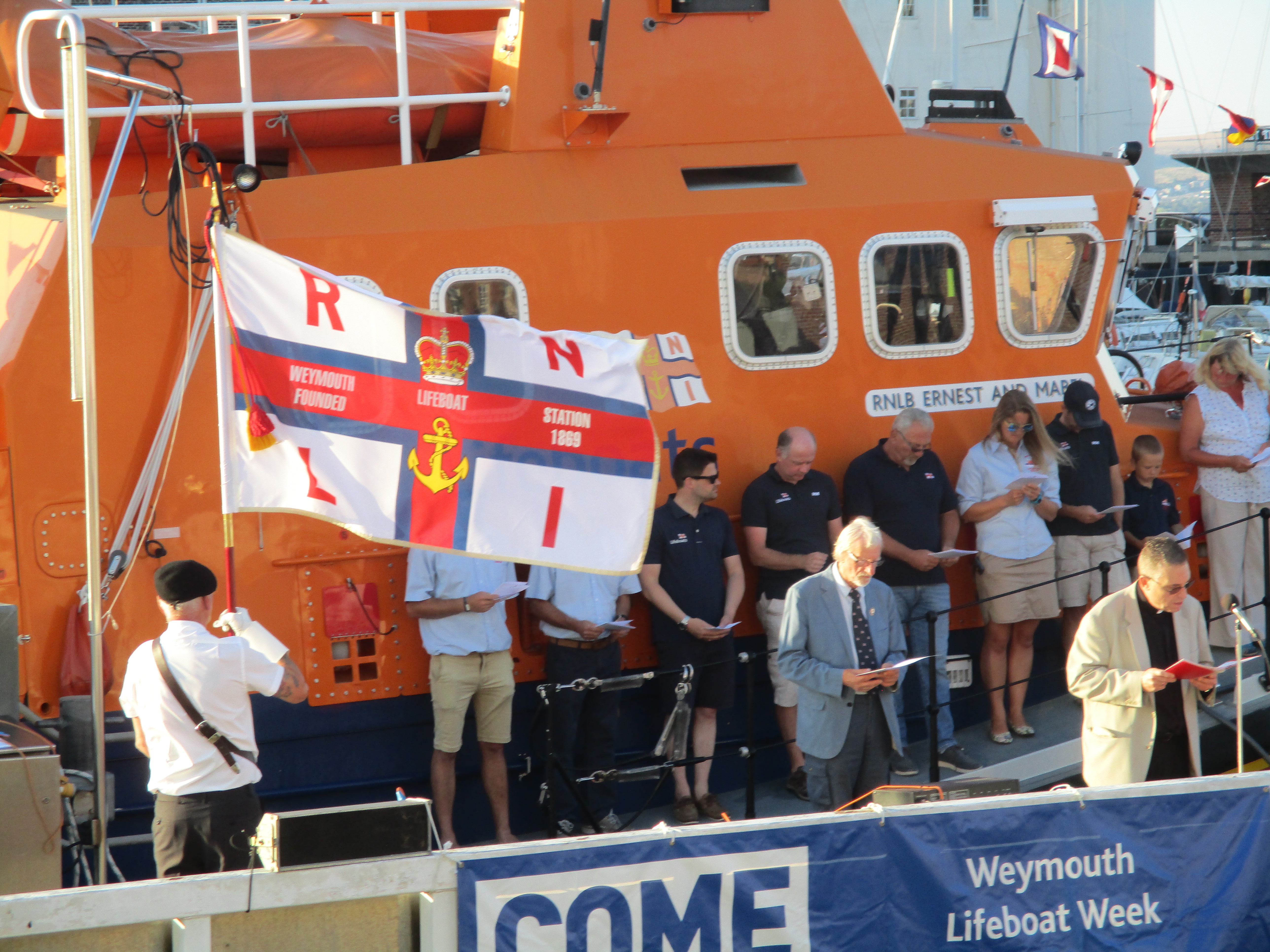 The RNLI standard flying proudly at the Blessing of the lifeboats service 2018