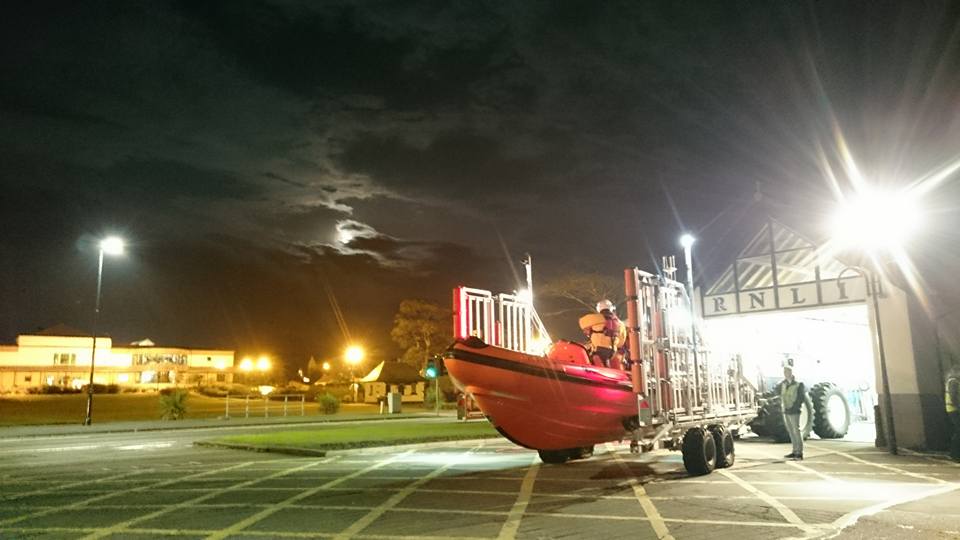 Lifeboat leaving the shed at night