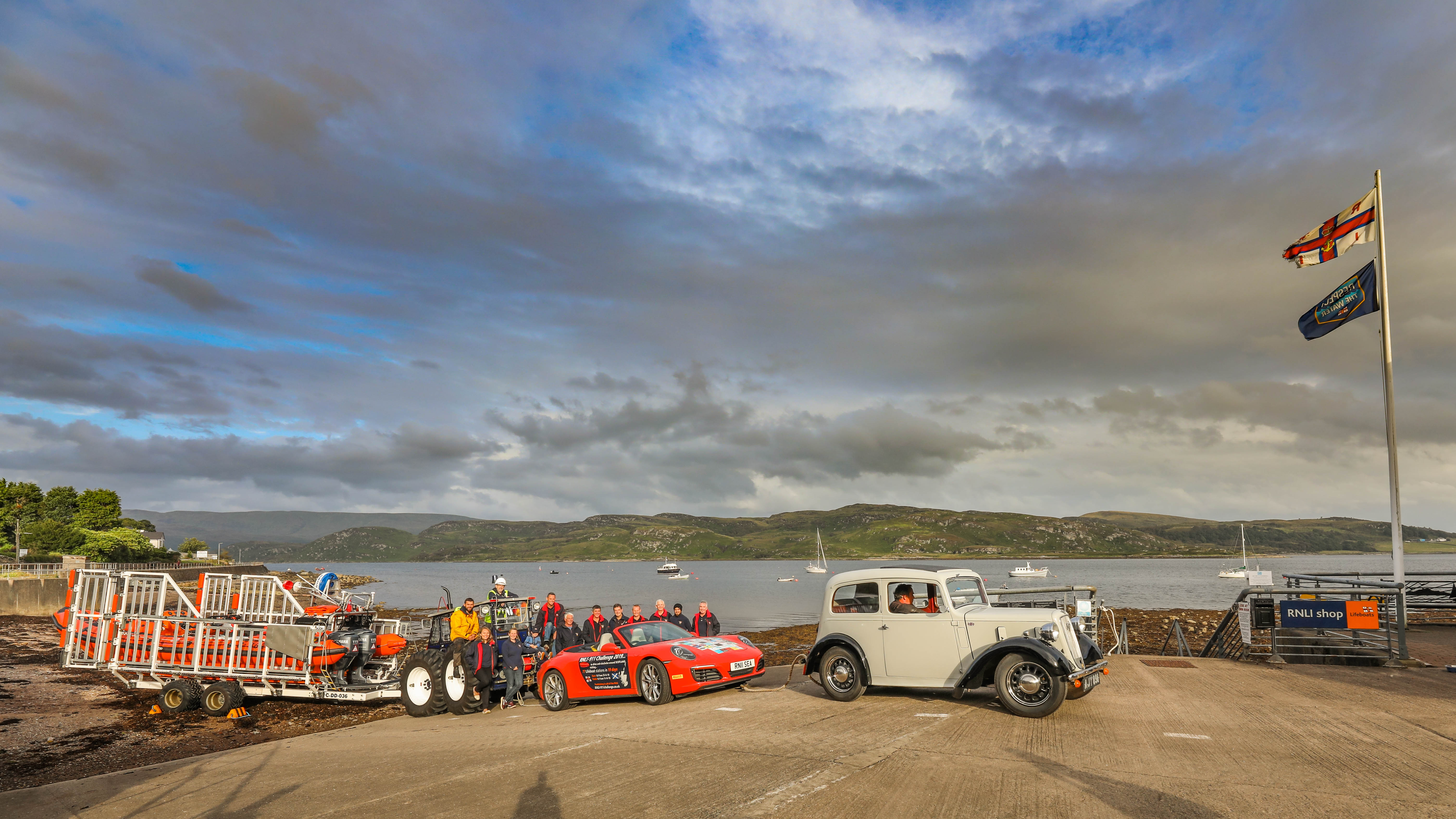 The Tighnabruaich lifeboat on the station slip with the 911 challenge car and an Austin 7