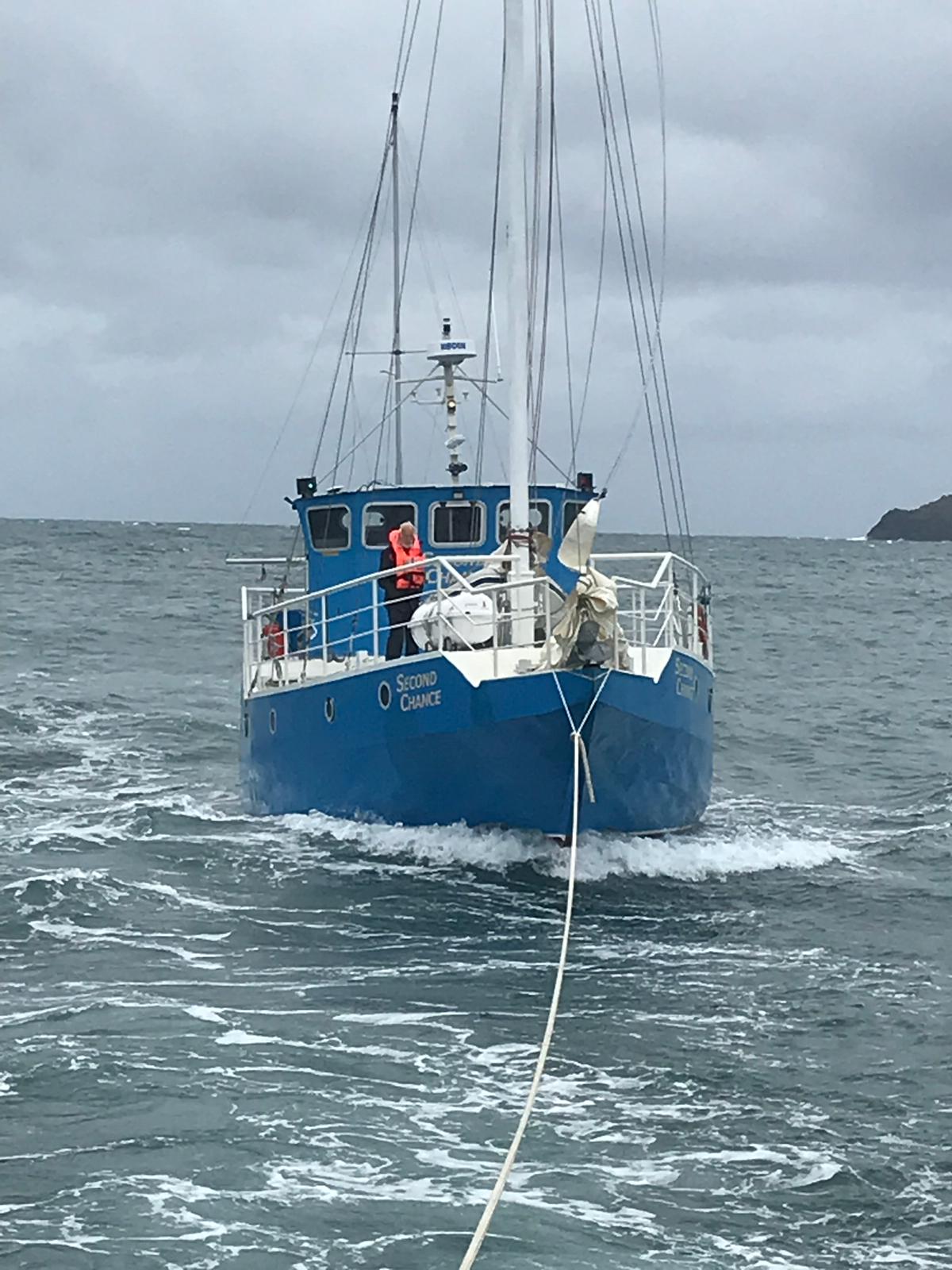 Motor cruiser under tow