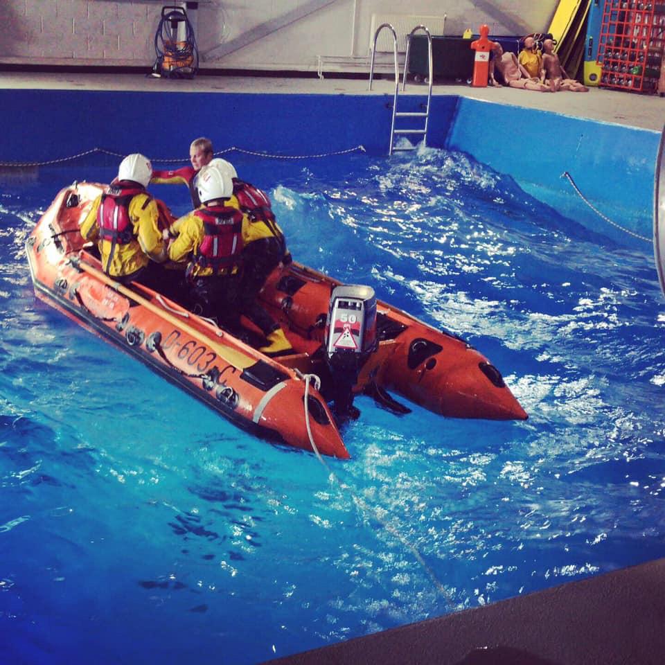 The three volunteers from Anstruther in the RNLI's sea survival training pool