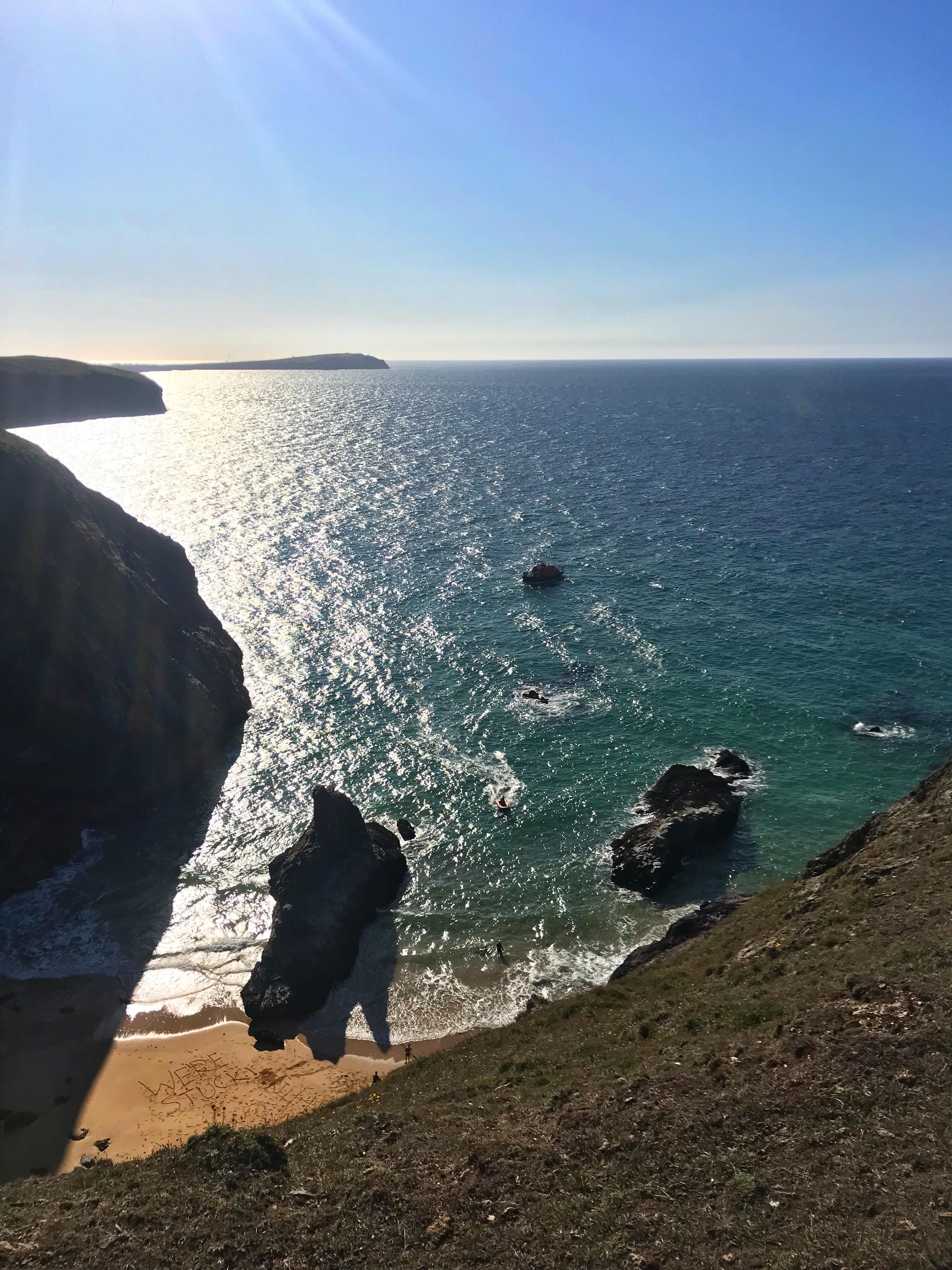 view from Butterhole clifftops of Padstow RNLI lifeboat Y-boat heading to beach