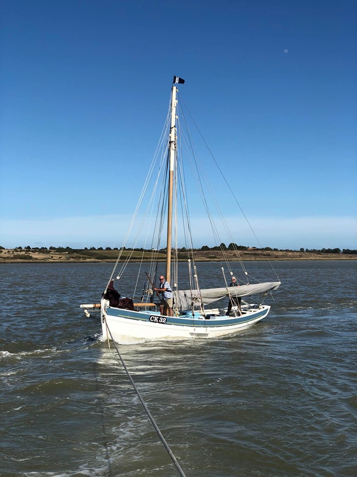 The ancient fishing vessel under tow
