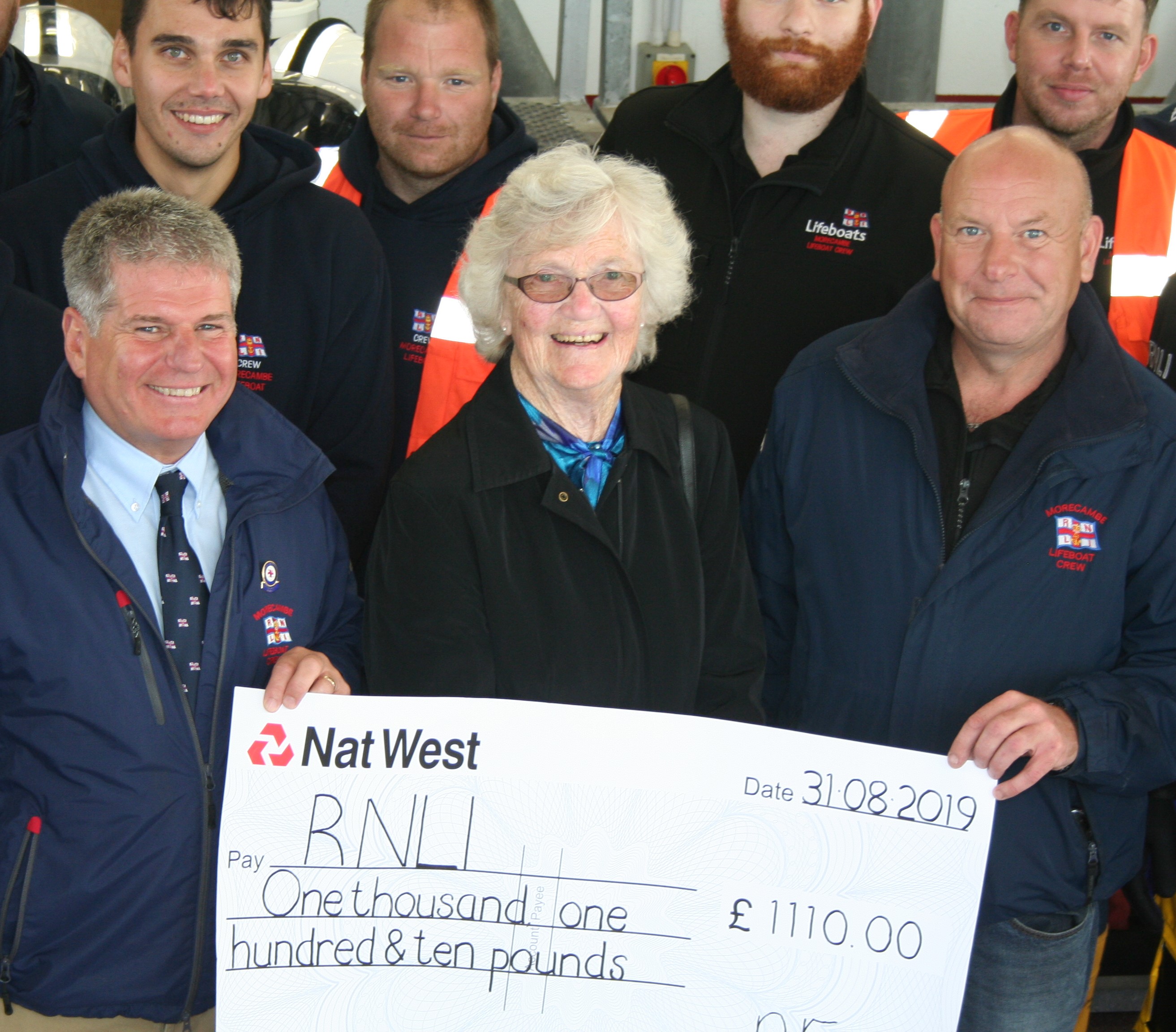 Adeline Franken presents her cheque to the crew