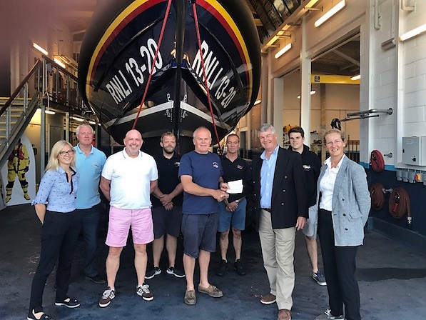 Mark Lee presents cheque to deputy 2nd coxswain