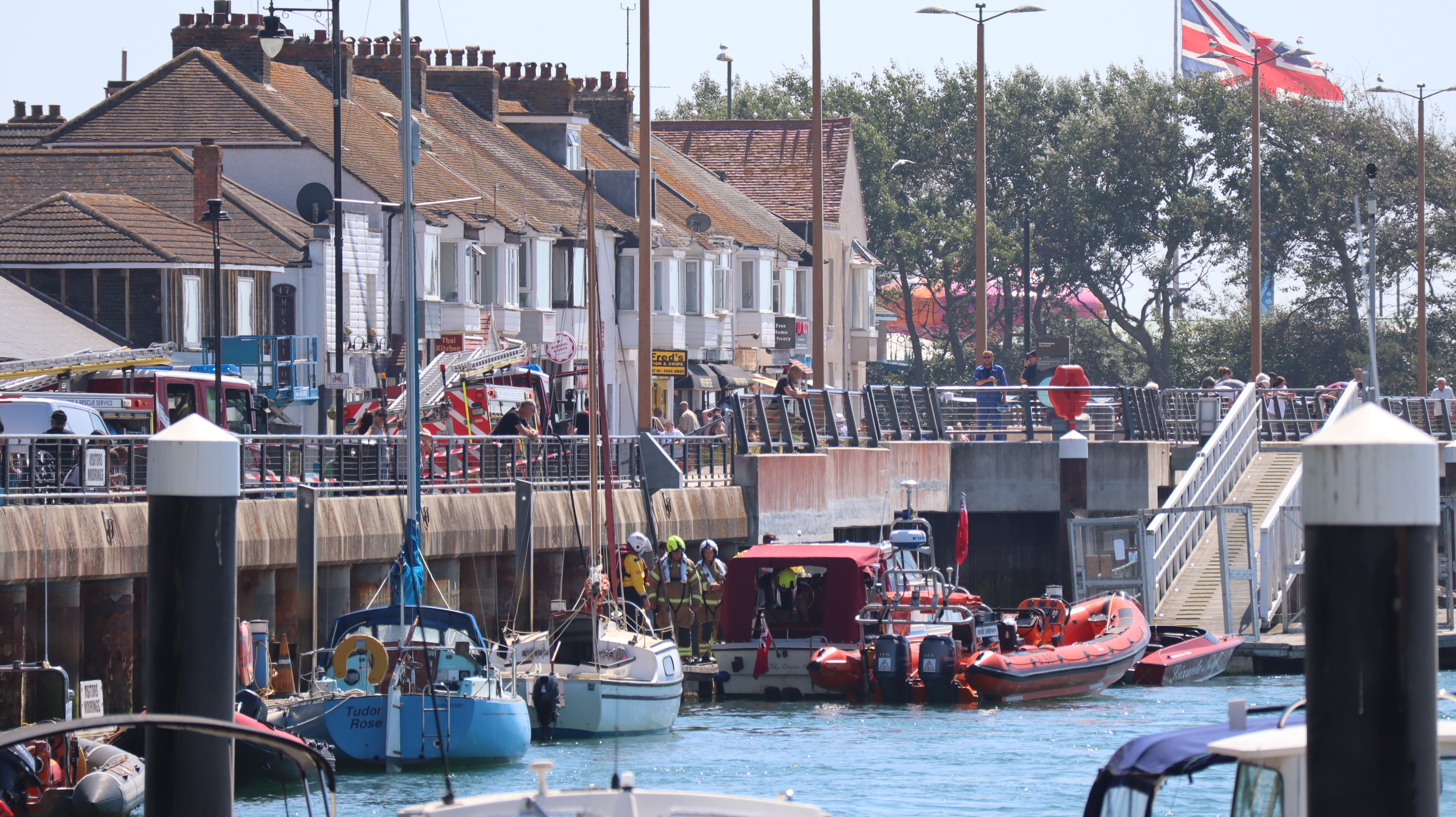Littlehampton RNLI's Renee Sherman and fire service check a vessel at Town Quay