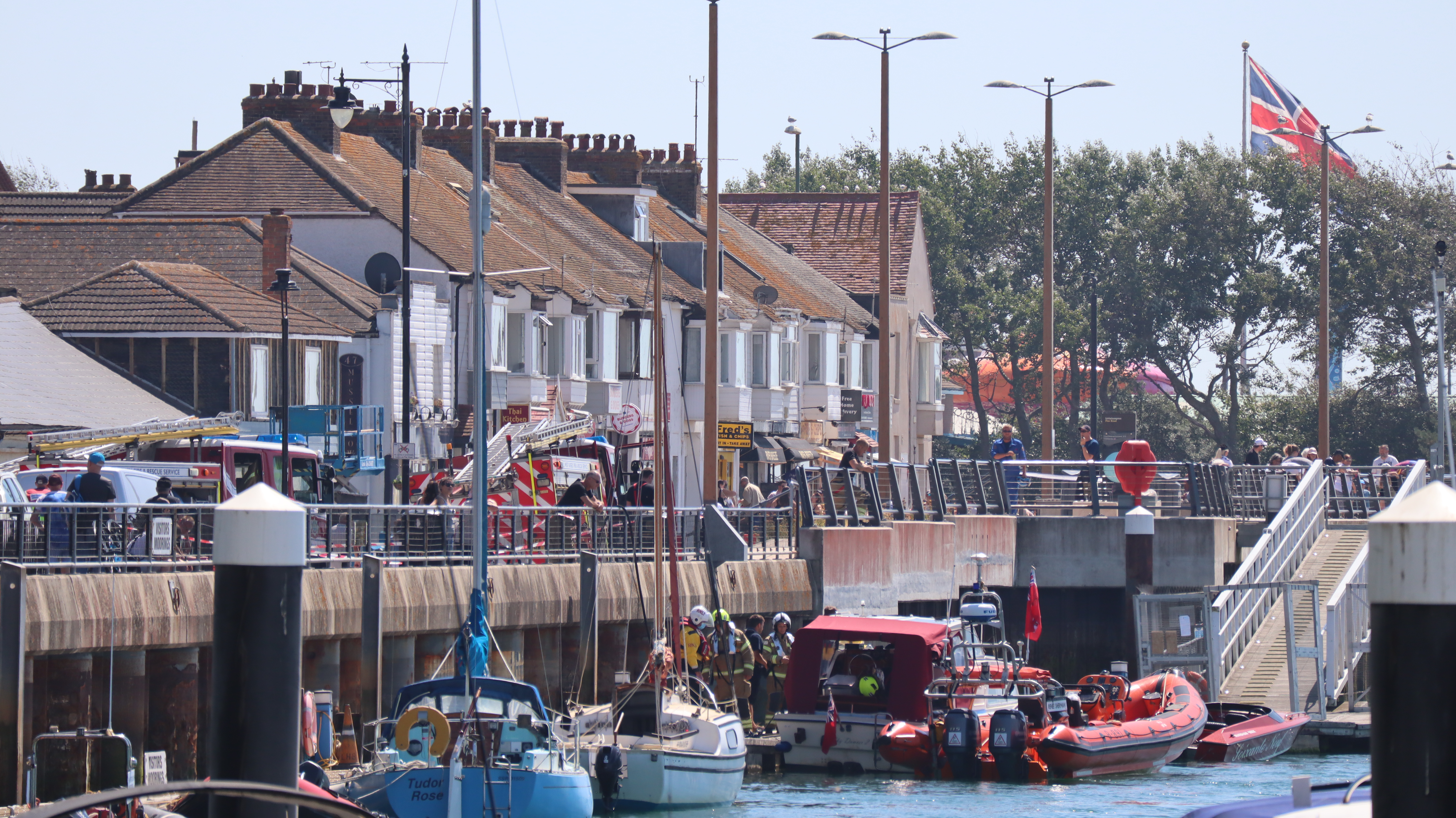 Littlehampton RNLI's Renee Sherman and fire service check a vessel at Town Quay