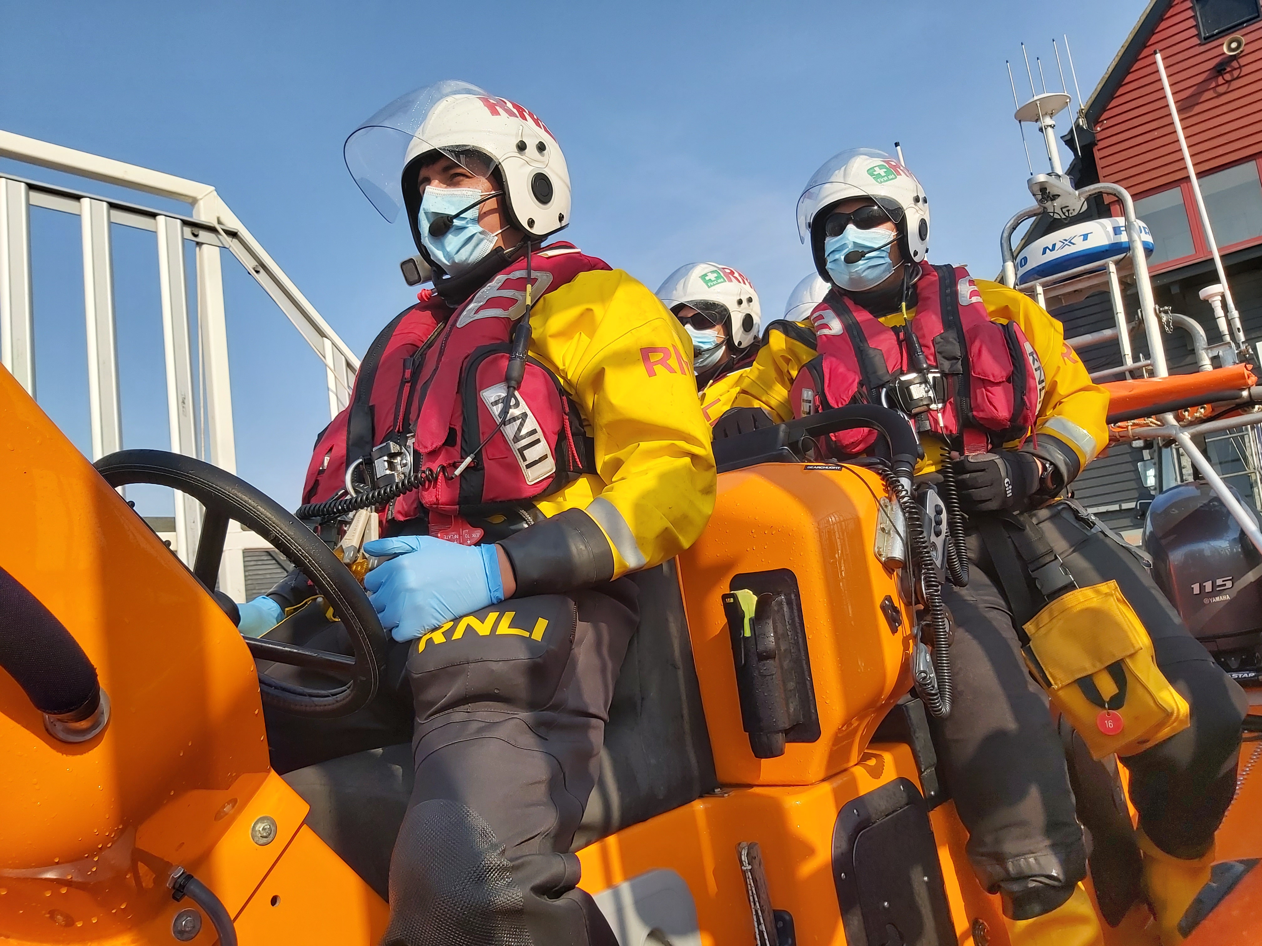 Sign of the times, the crew of the Whitstable Atlantic 85 lifeboat Lewisco about to launch to the 30-foot fishing vessel Simon Issac after the vessel suffered a blocked fuel filter off Whitstable on Sunday afternoon. Picture: Chris Davey/RNLI Whitstable.