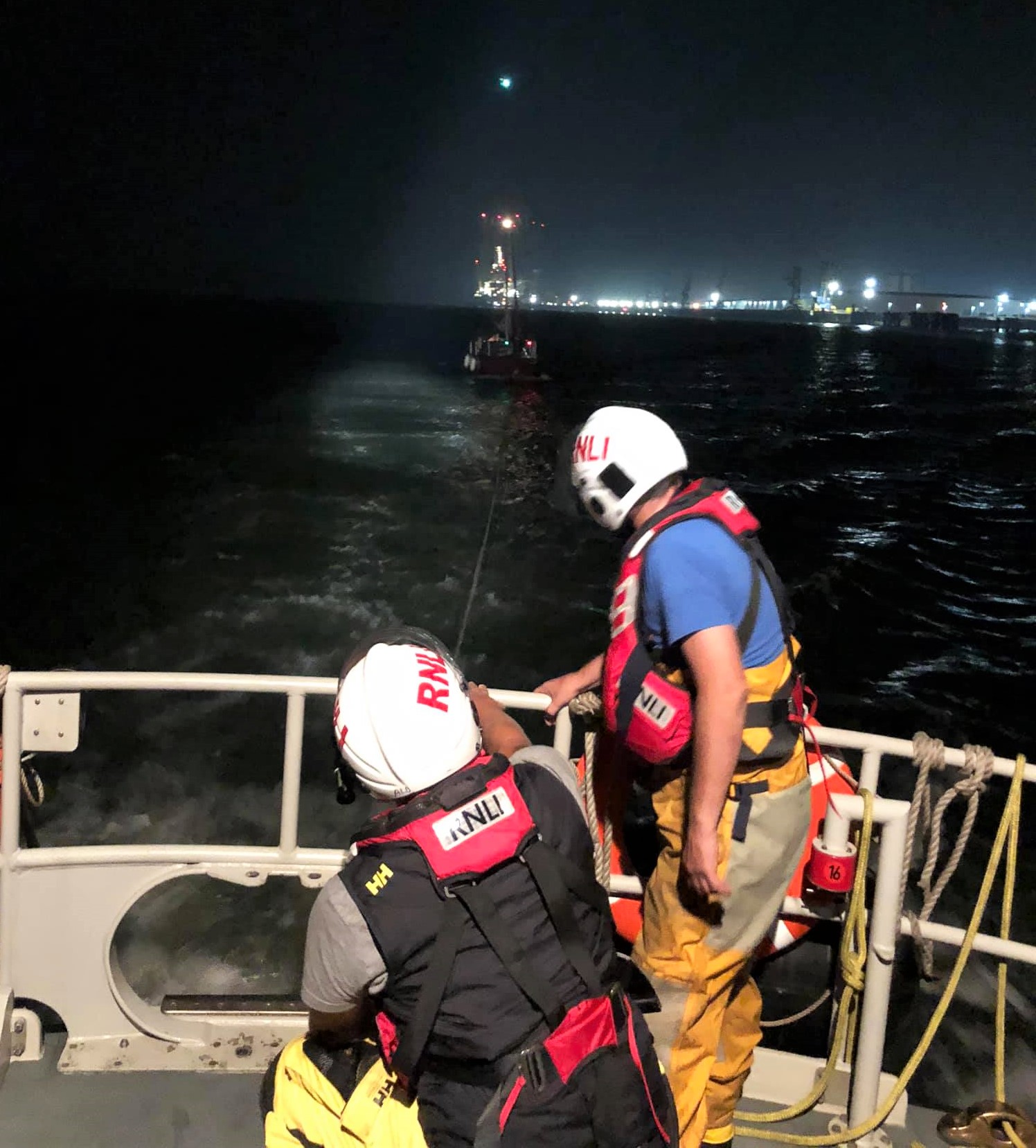The casualty craft being towed out of danger in the very bust Thames estuary by the Sheerness all weather lifeboat
