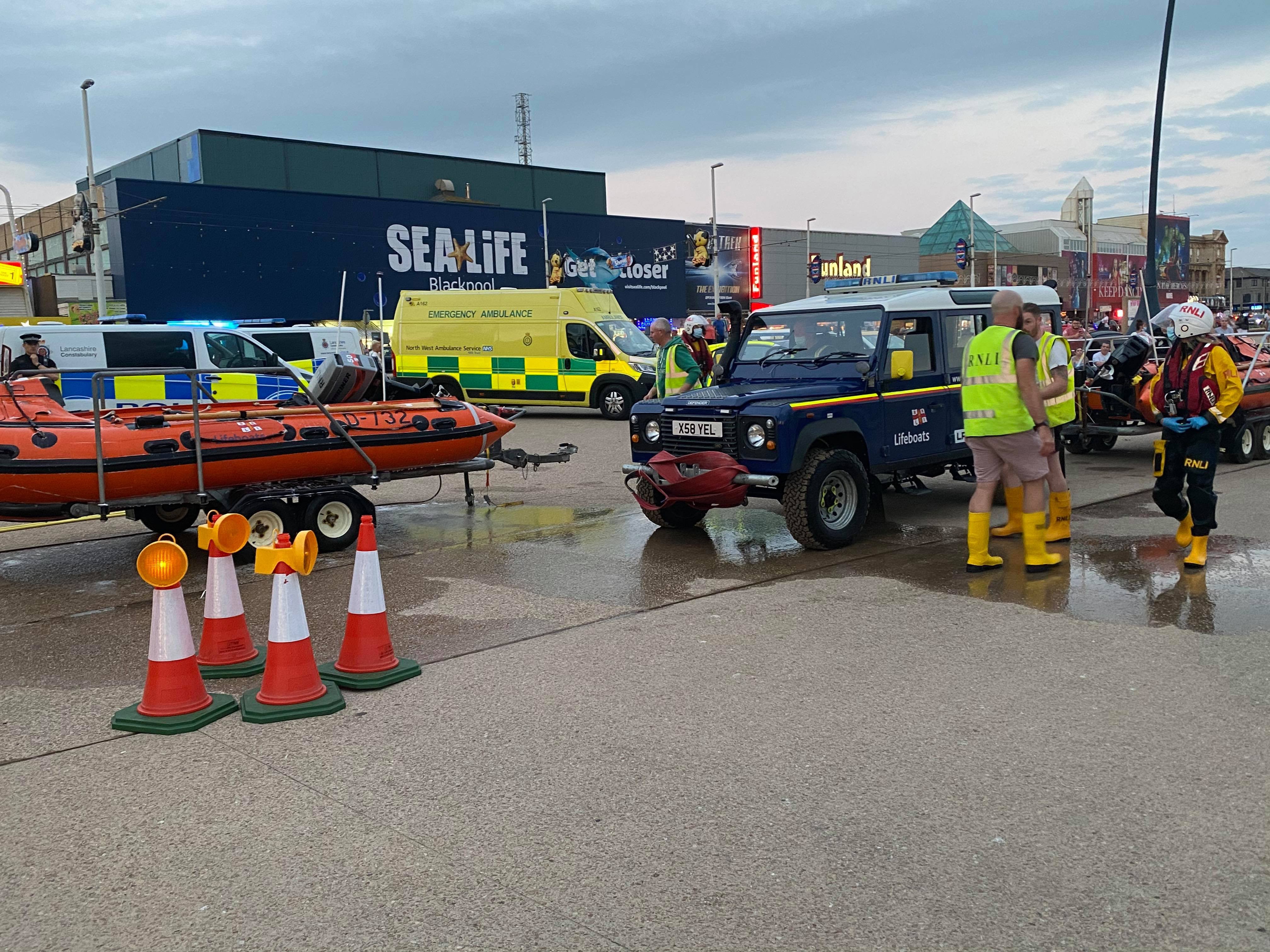 Blackpool RNLI volunteers with Police &amp; Ambulance visible in the background