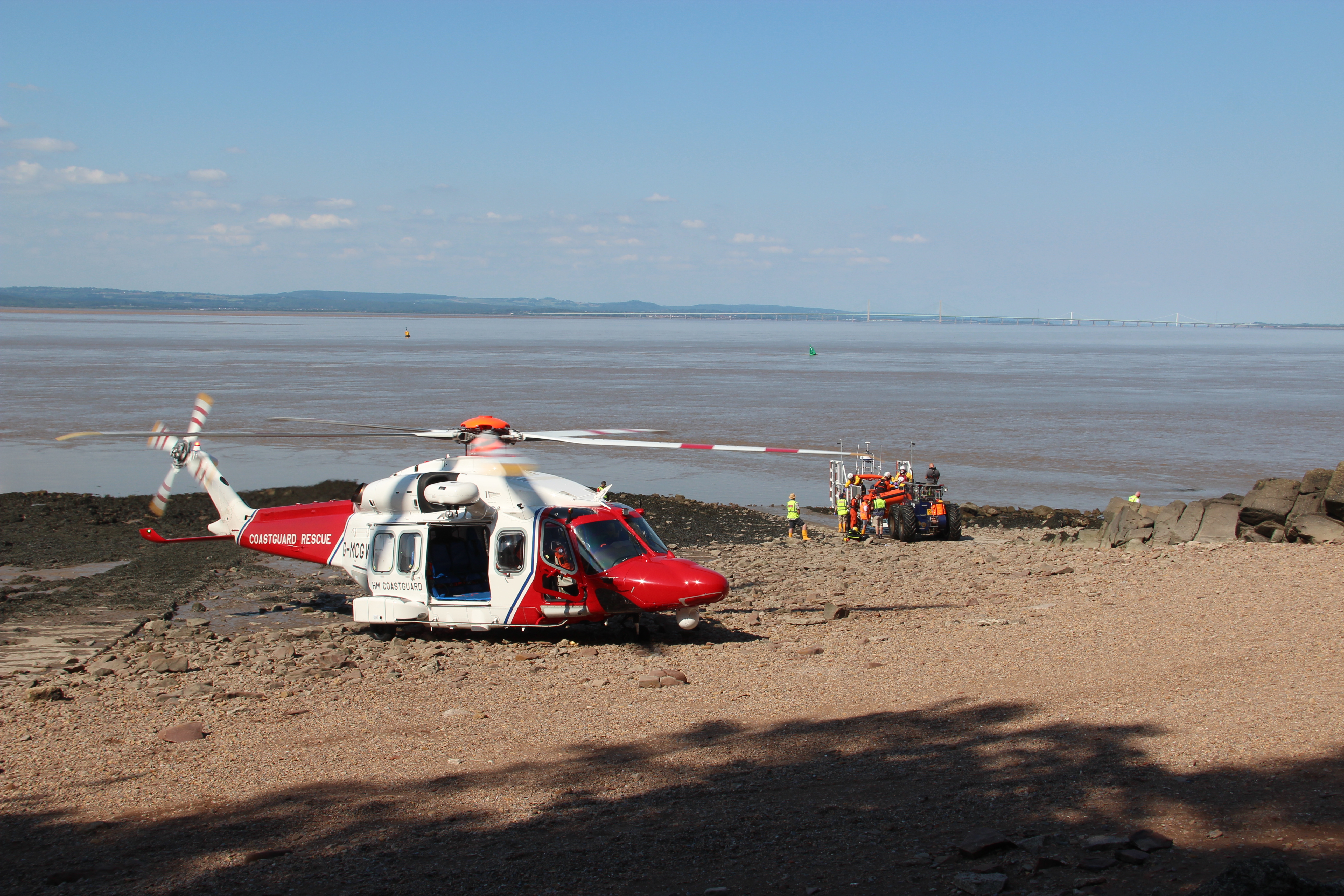 HM Coastguard and RNLI support the casualty before the transfer