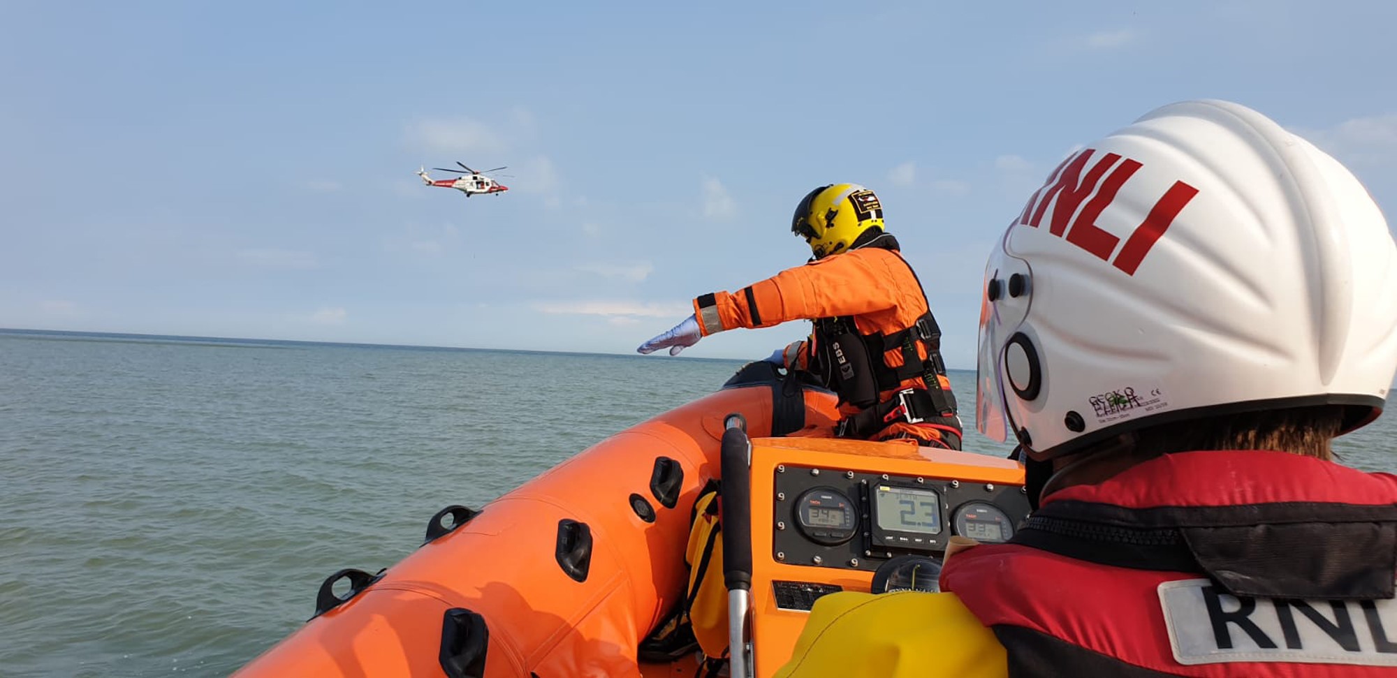 Photo of the Coastguard paramedic on board the lifeboat about to be lifted to the Coastguard helicopter.
