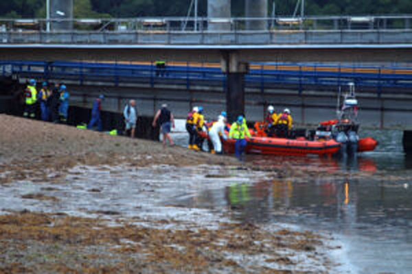 The Cowes RNLI lifeboat attends the casualty at Fishbourne