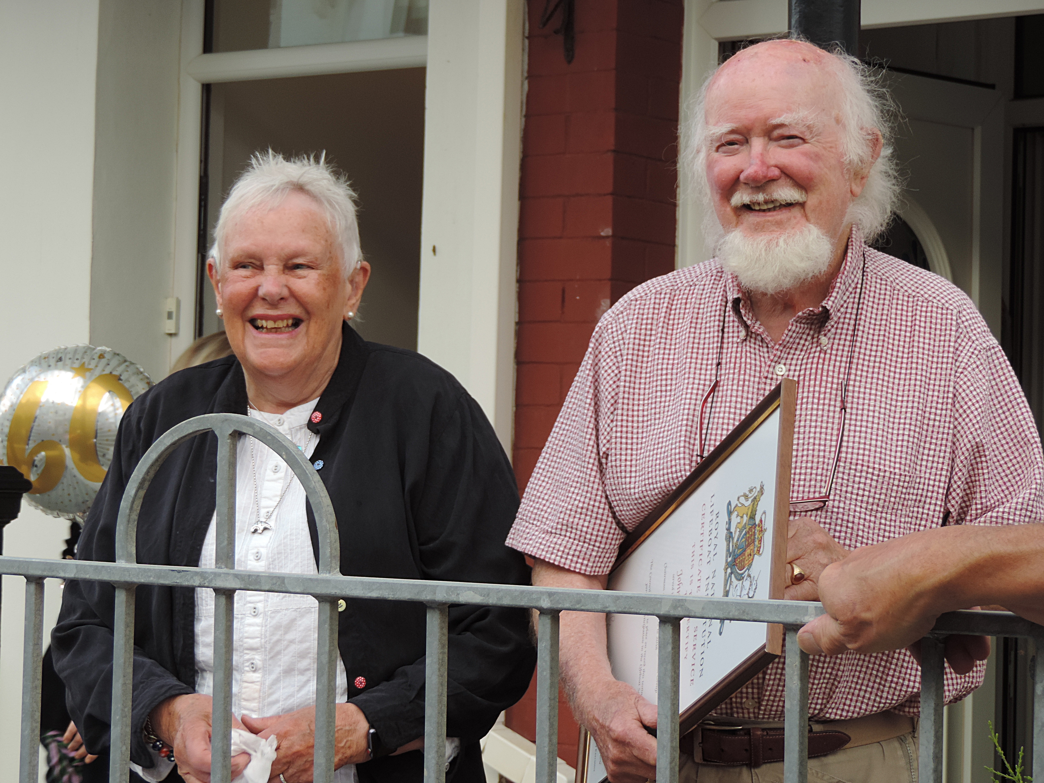 John and Marj having a surprise visit from crew and fund raisers