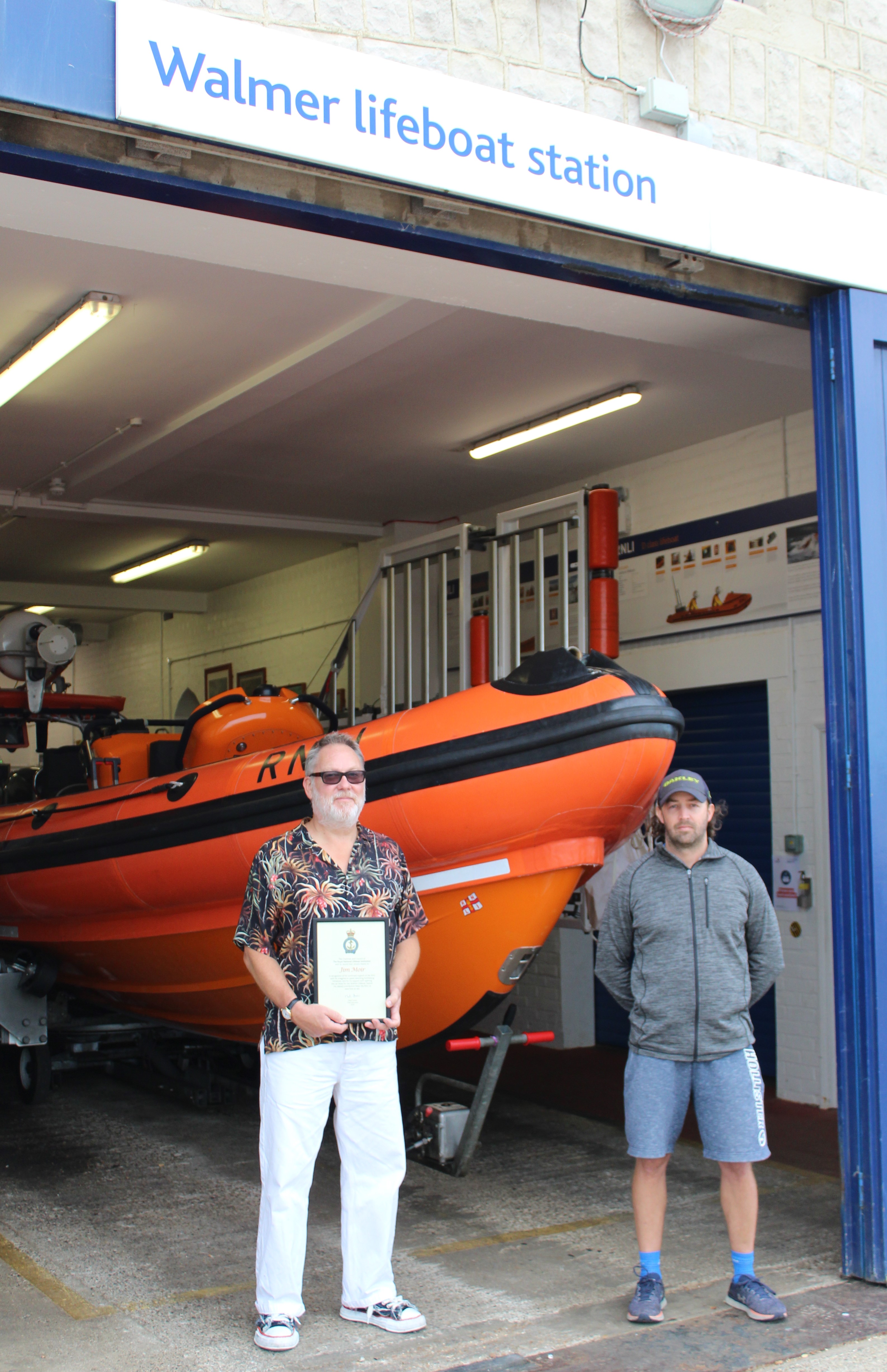Jim Moir receives Record of Thanks from crew member Steve Emptage