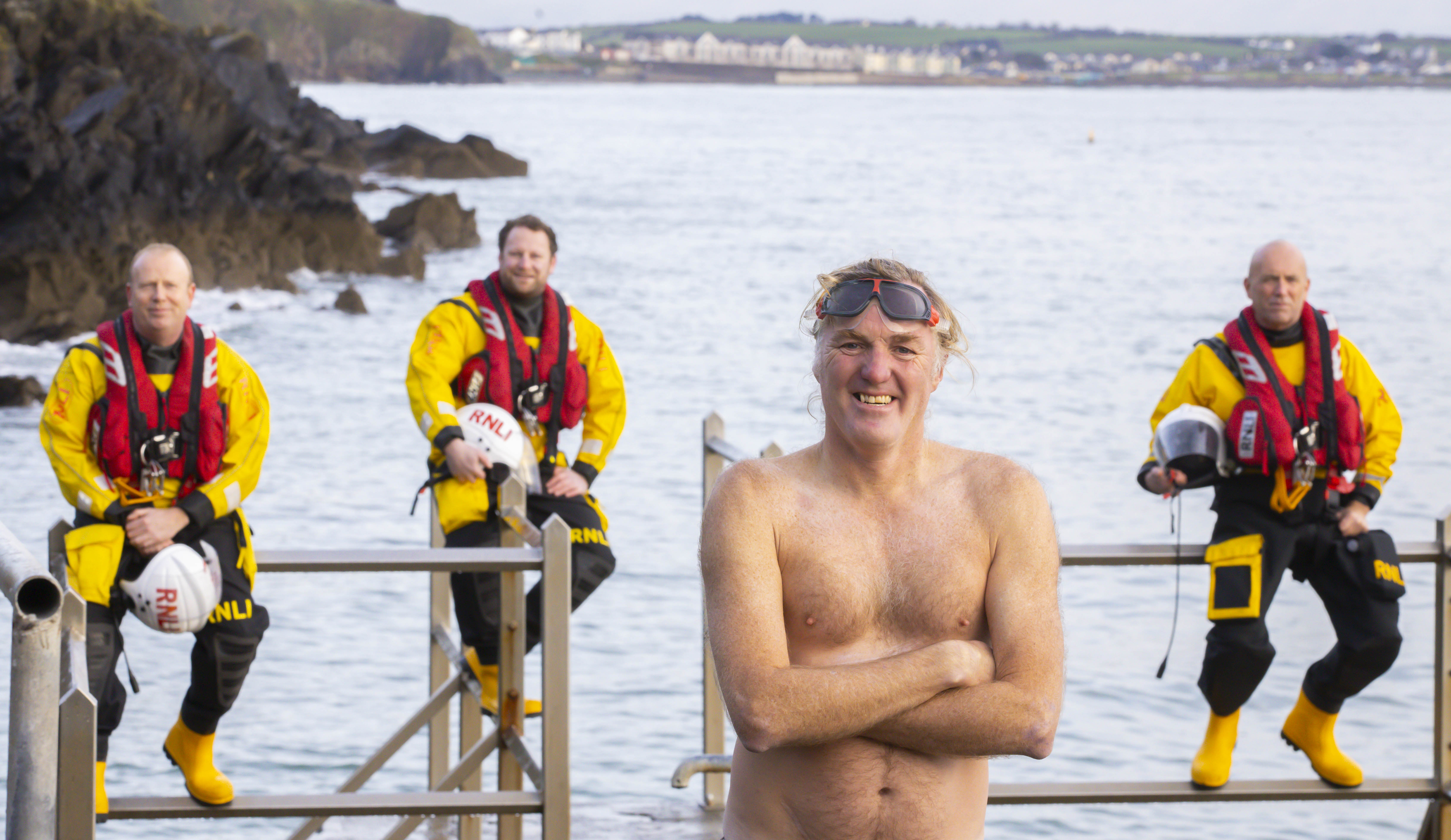 Rescued swimmer Michael Power with Tramore RNLI Helm Fergal McGrath crew Alec Fitzmaurice and Helm David McGrath