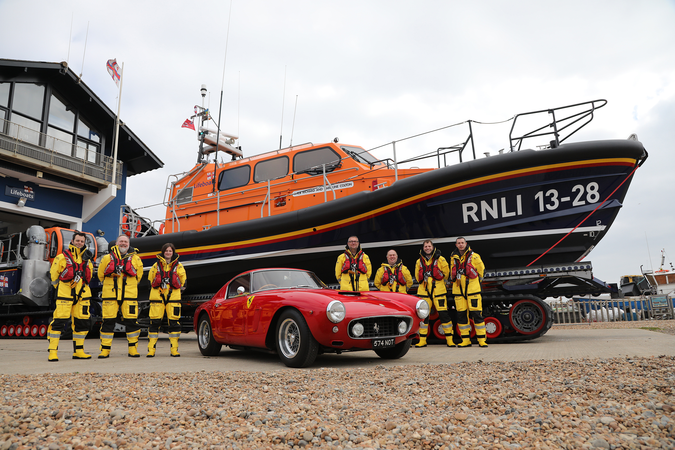 The crew of the Hastings Lifeboat 'Richard and Caroline Colton’ with one of the rare Ferraris.