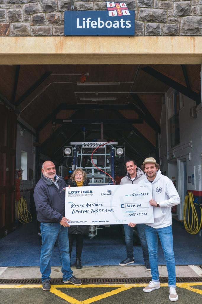 Phill Brown &amp; Sue McCann accepting the donation from Ollie and Mike