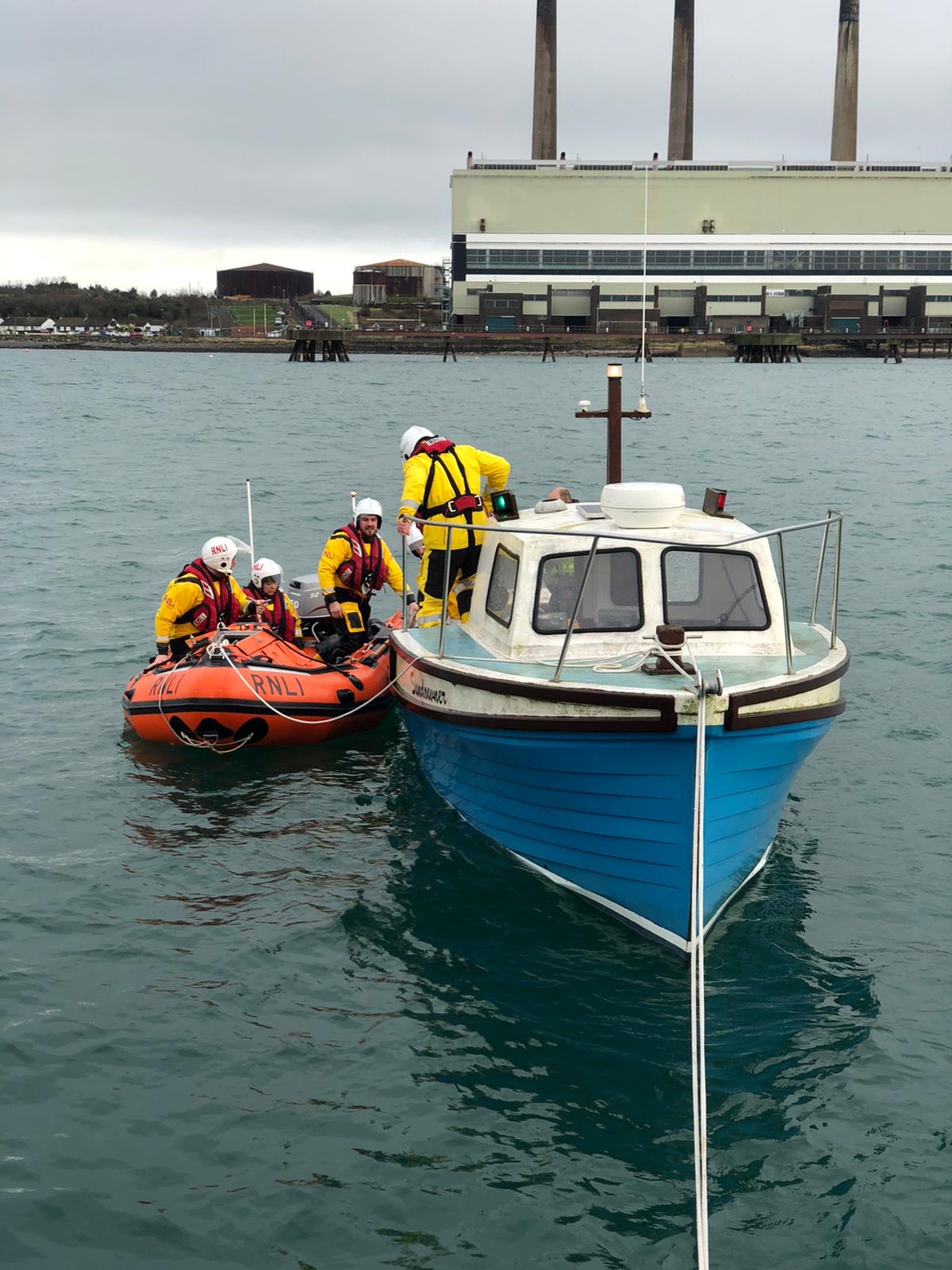 Larne RNLI inshore lifeboat, Terry, establishing alongside tow 