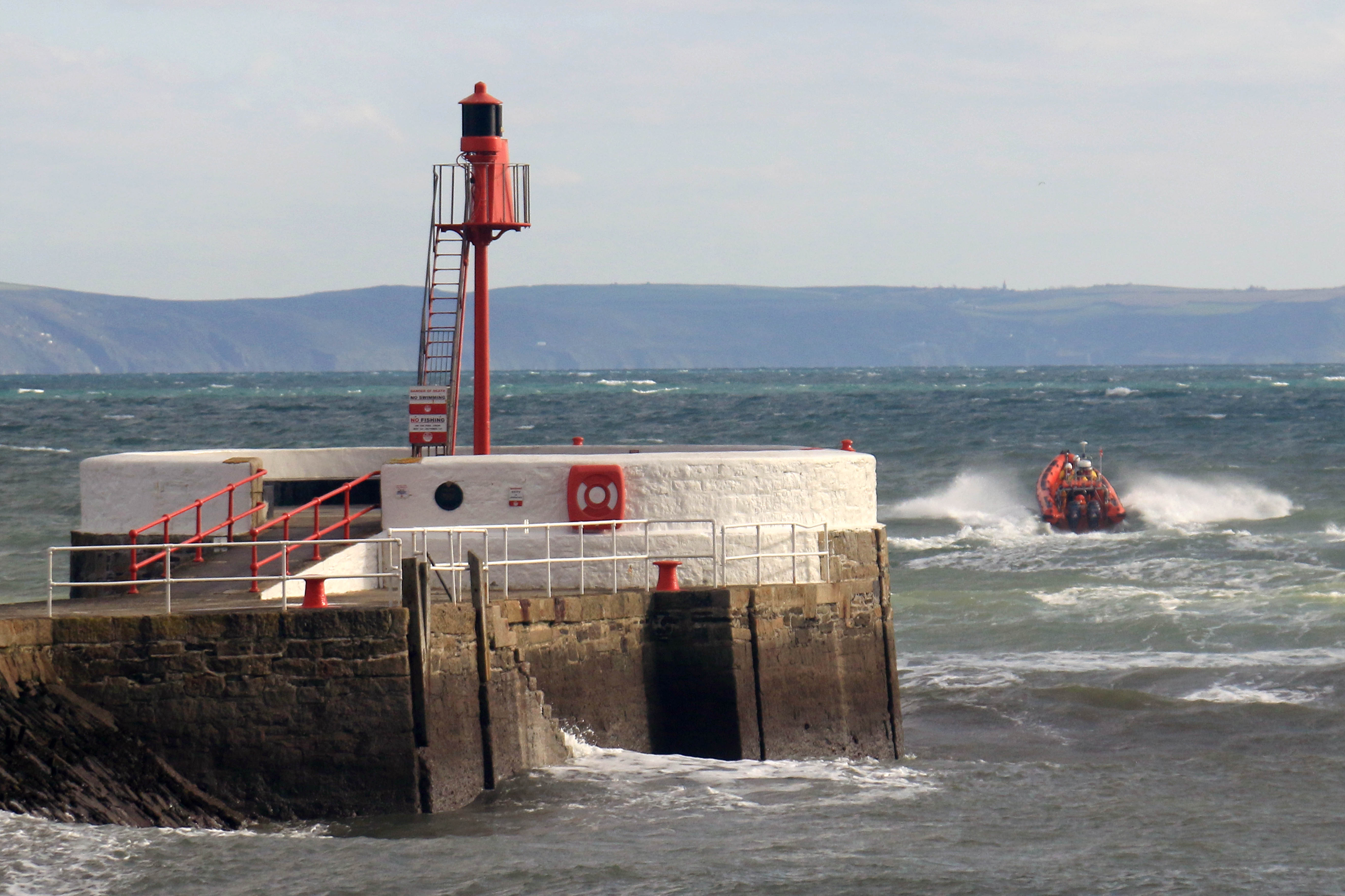 Looe RNLI Atlantic 85 Sheila and Dennis Tongue II leaving Looe and heading towards Seaton