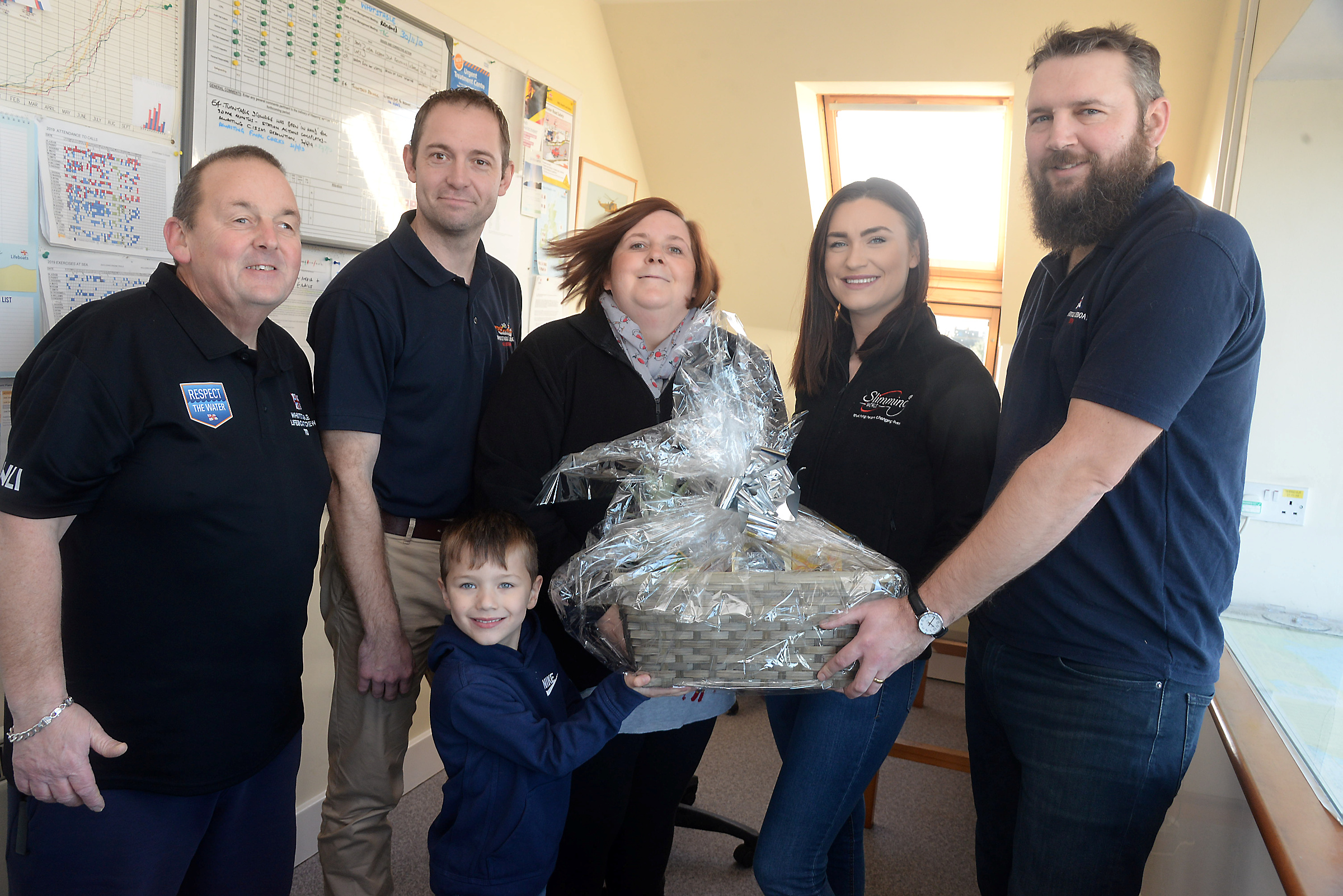Kerry Coleman, Alexandria Godden and Blake Godden, four presented a 'healthy hamper' to Whitstable Lifeboat Station just before Christmas on behalf of Slimming World, Whitstable.Also pictured are Neil Pepper, Ben Crosswell and Richard Monje from the station.