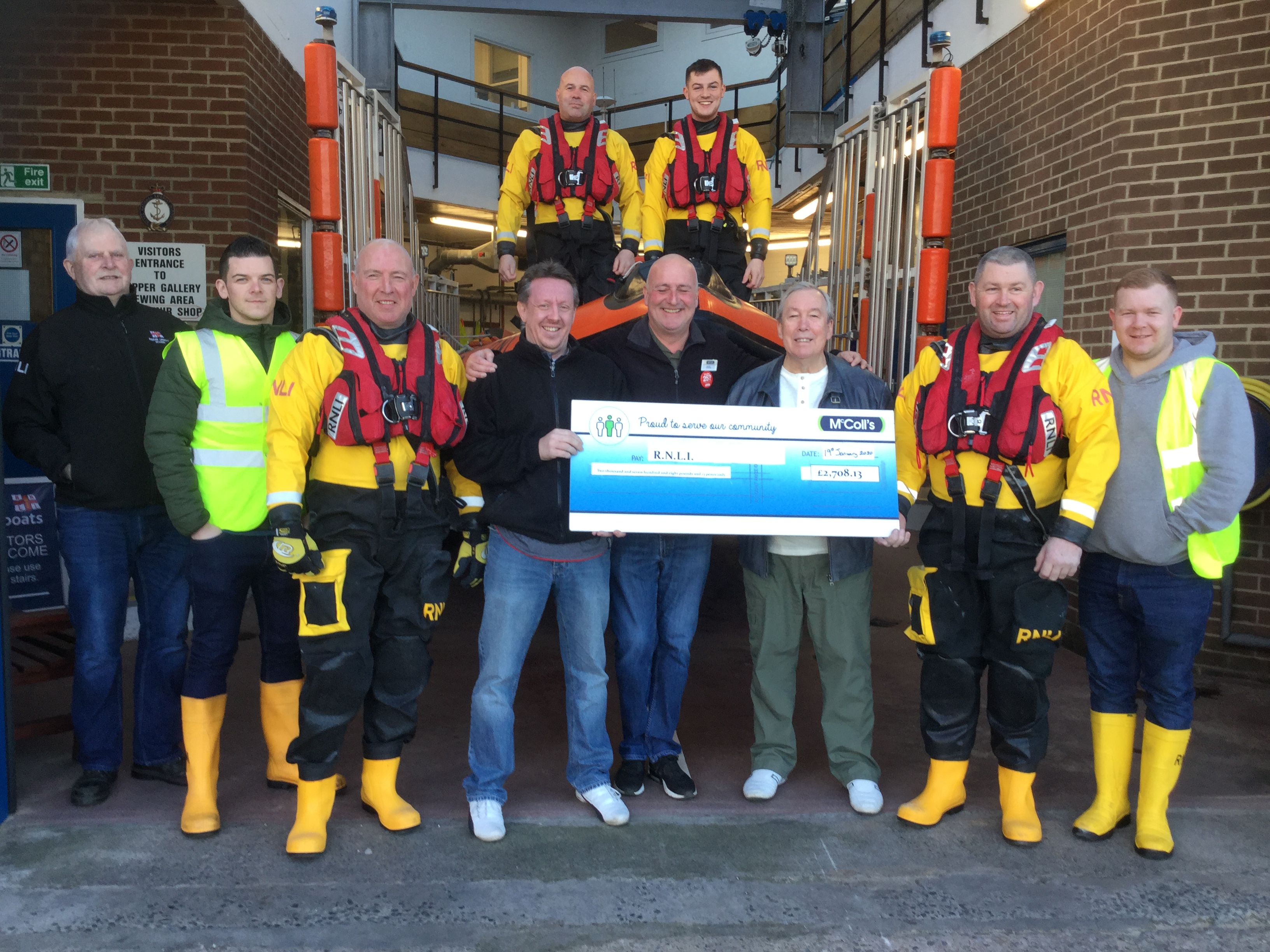 McColl's representatives presenting the donation to the Redcar lifeboat station