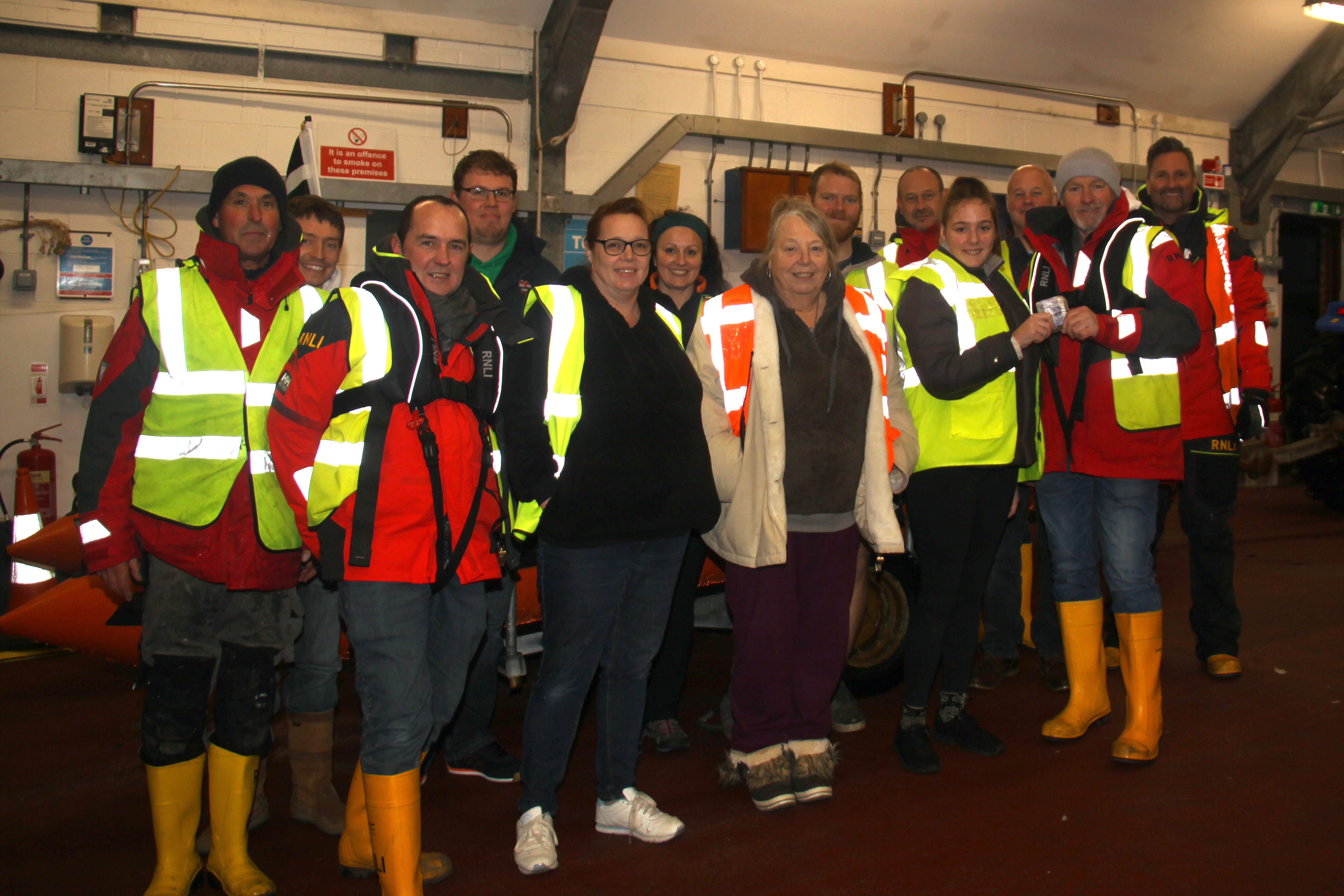Simon Rawe accepting the donation from Kate Marsh, Sue Marsh and Suzie Bowden and Looe RNLI volunteer crew (1)