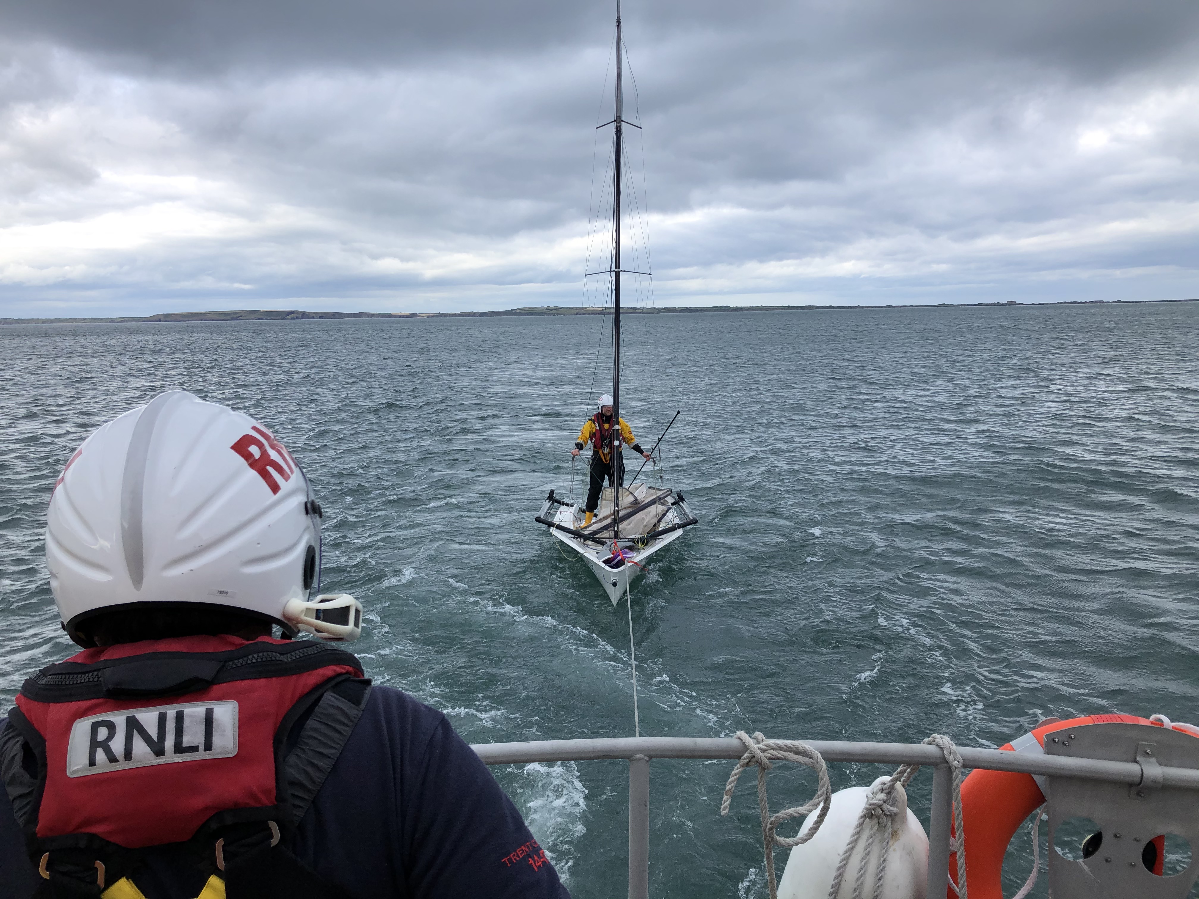 Dinghy under tow, RNLI crew on board