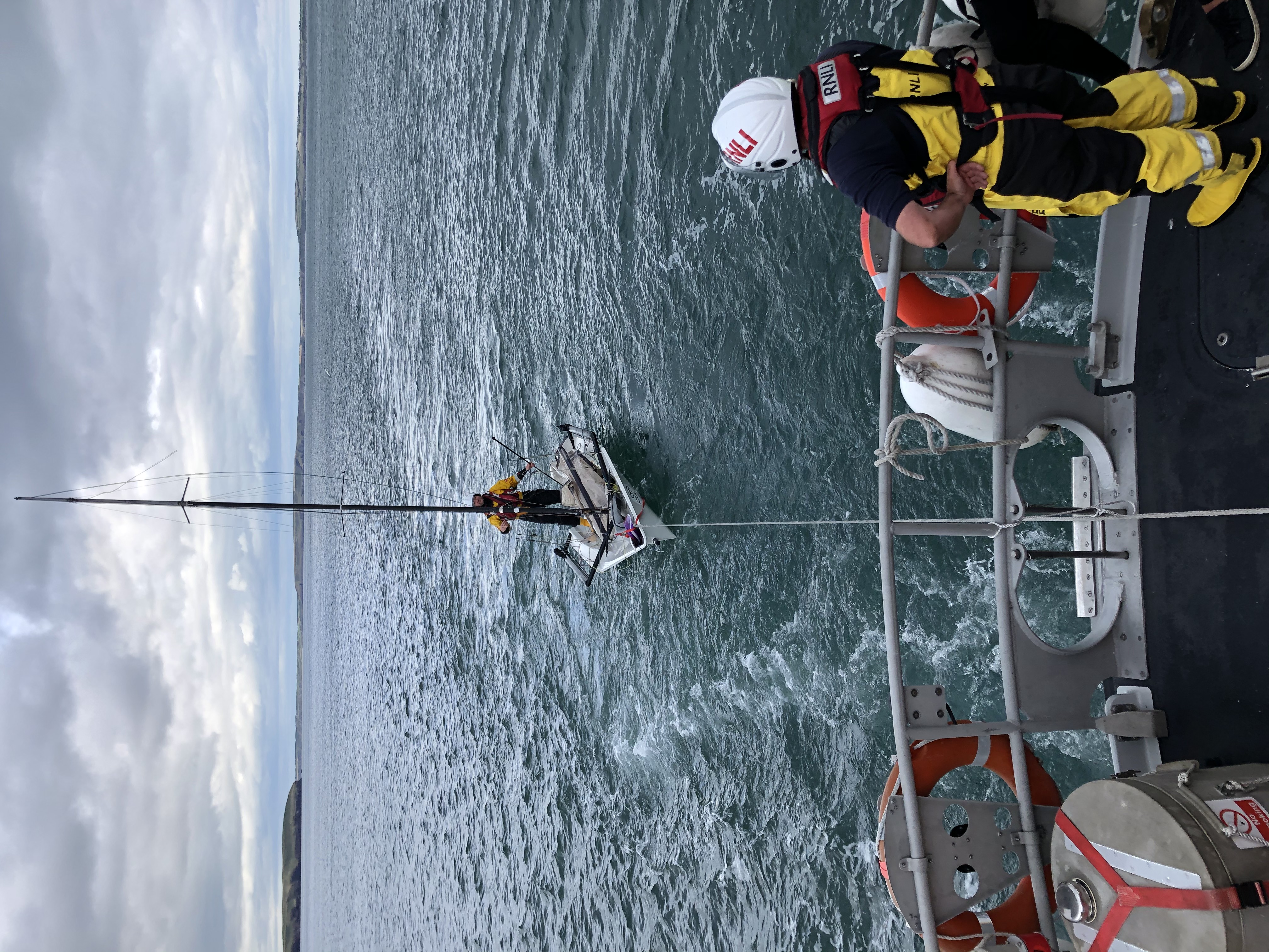 Dinghy under tow, RNLI crew on board
