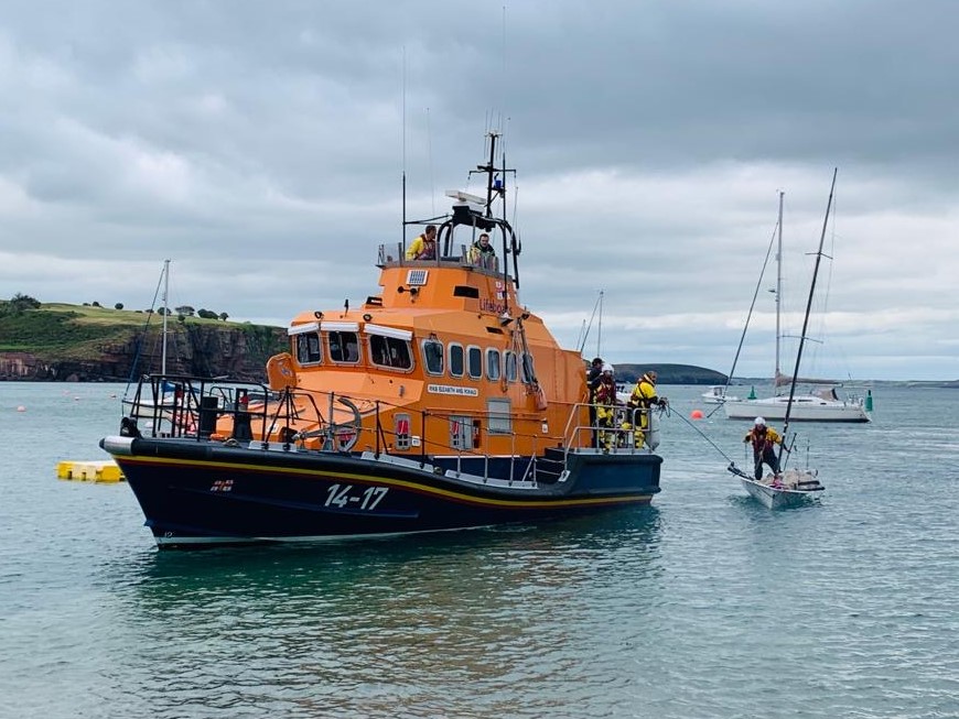 Dinghy under tow, RNLI crew on board
