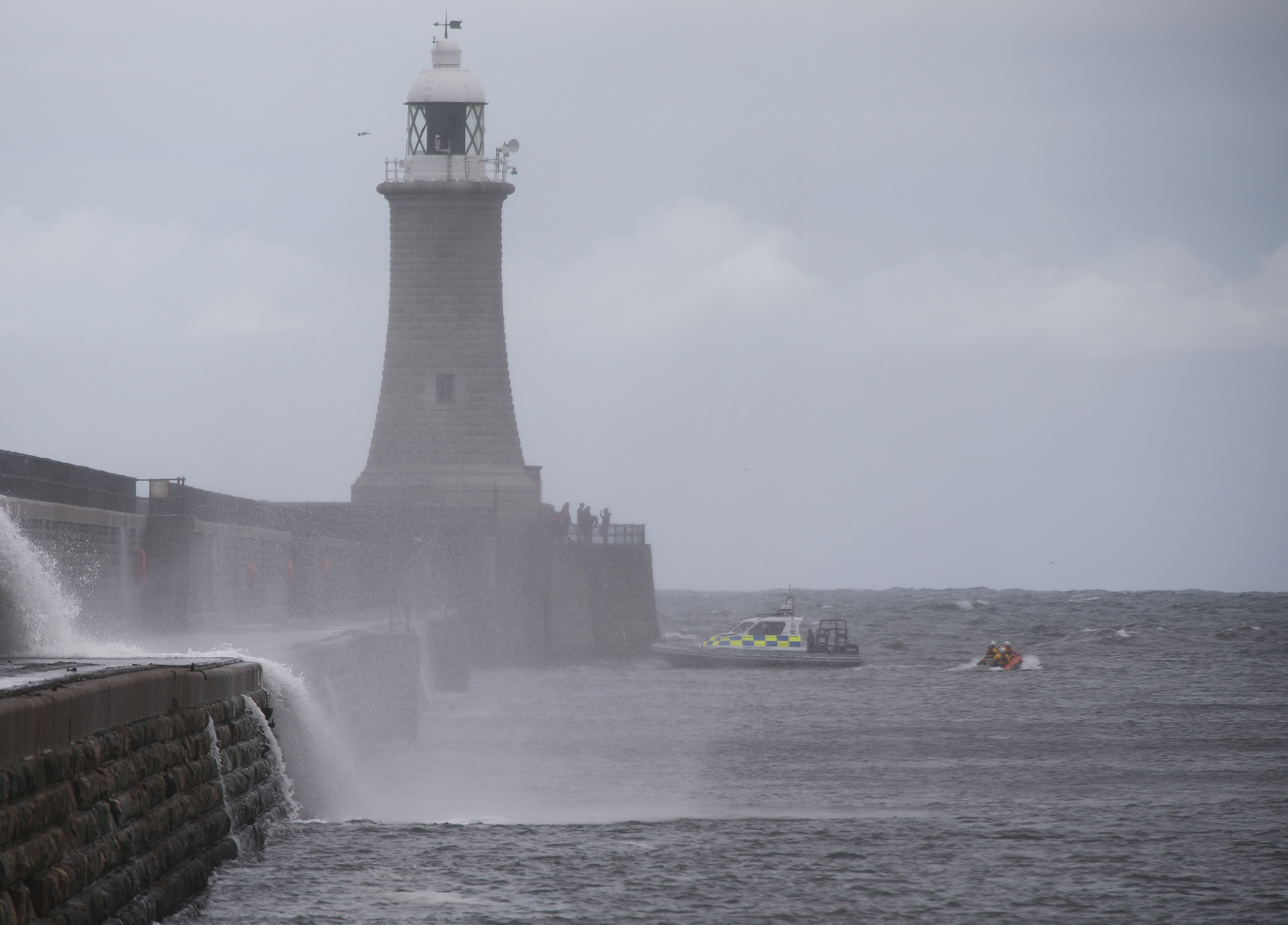 SIX men fishing from the end of Tynemouth pier sparked a major emergency services response on Sunday afternoon. This pic: The fishermen clearly visible on the pier as the police launch and Tynemouth RNLI inshore lifeboat stand by