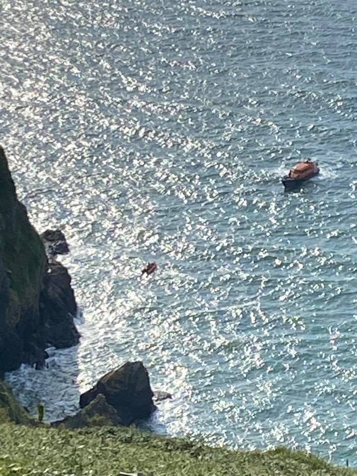 Ilfracombe lifeboats near sea cliffs at Sillery Sands