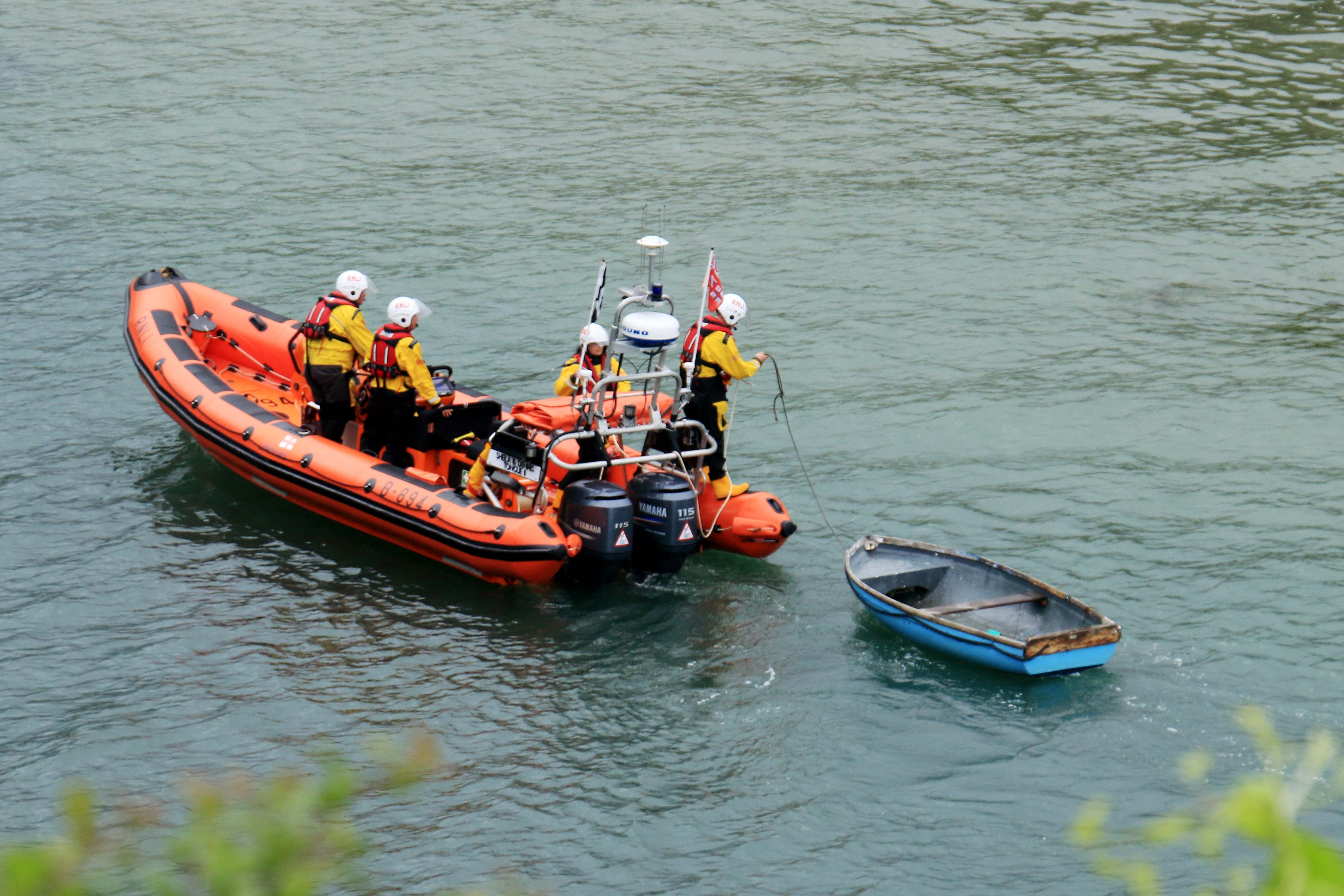 Looe RNLI Atlantic 85 Sheila and Dennis Tongue II towing the dinghy back to the lifeboat station