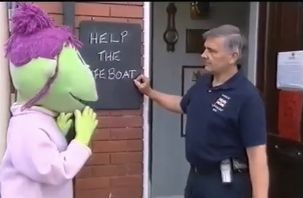 Rod Parry outside the lifeboat station with Judy the Tweenie 