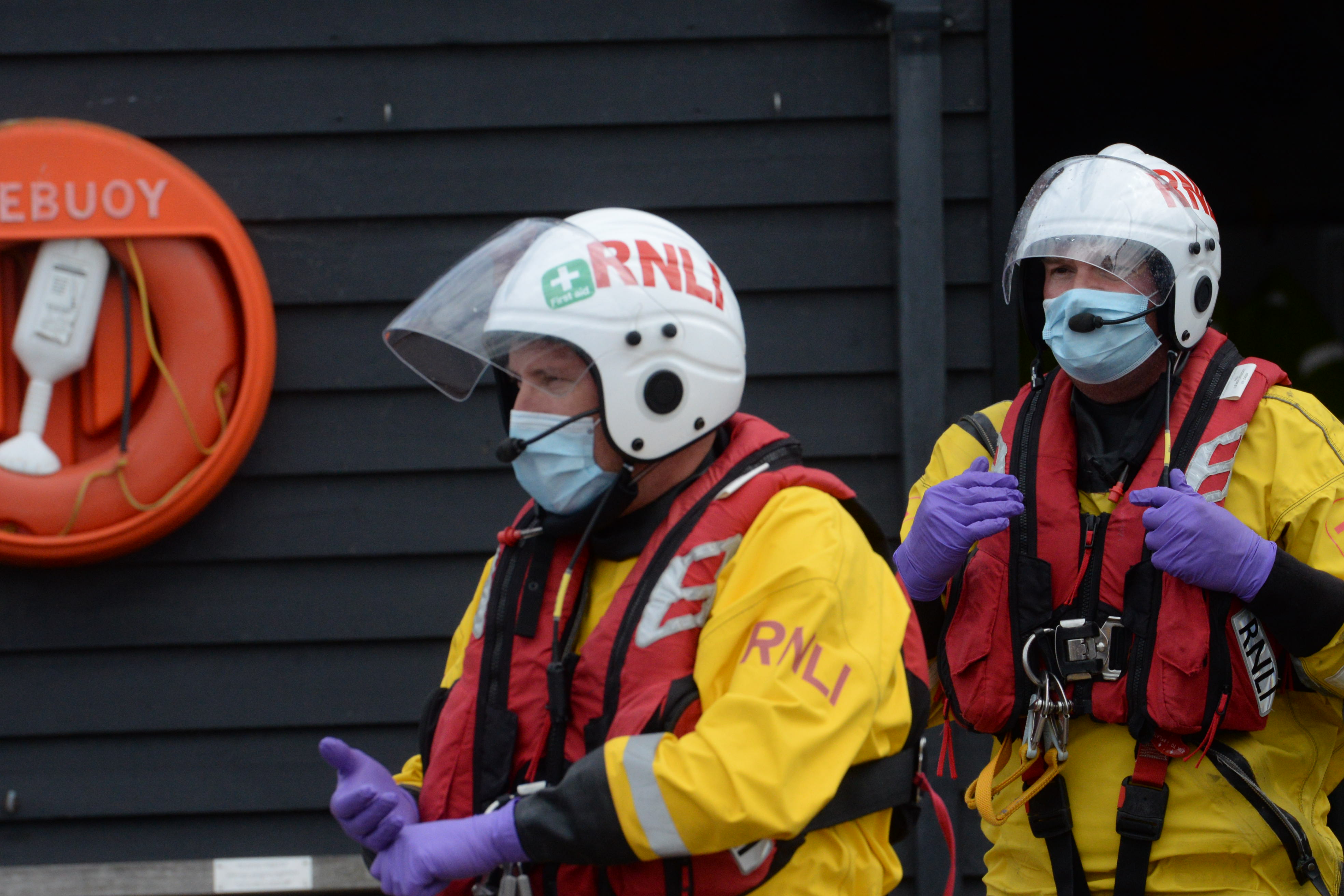 A sign of the times, lifeboat crewmembers wearing face masks at Whitstable Liifeboat Station after assisting a paddleboarder in difficulties off Seasalter on Friday afternoon. Picture: RNLI Whitstable.