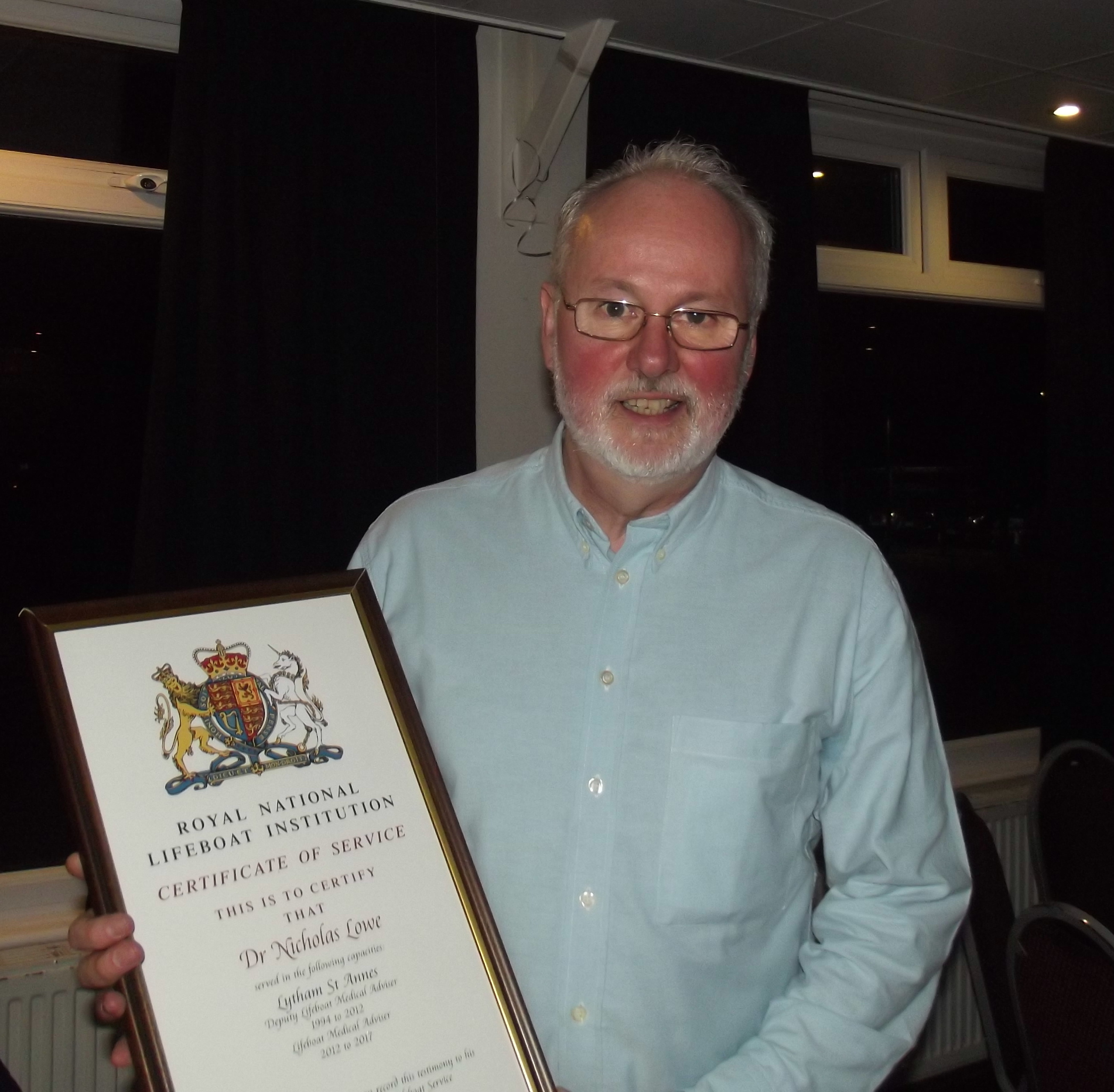 a man holds a large framed certificate