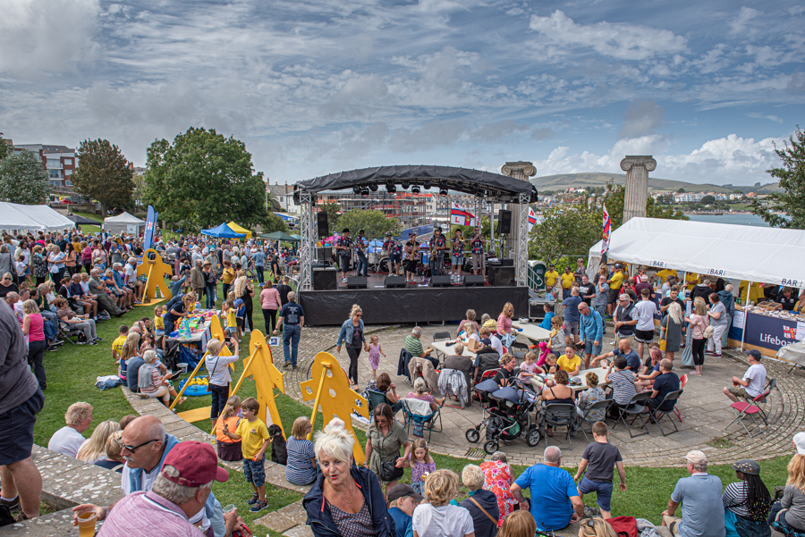 Saturday afternoon during Swanage Lifeboat Week on Prince Albert Gardens. Live music, games, bar and BBQ all in full swing.