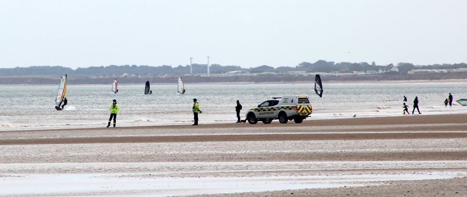 A Coastguard vehicle awaits the return of the inshore lifeboat on Bridlington beach