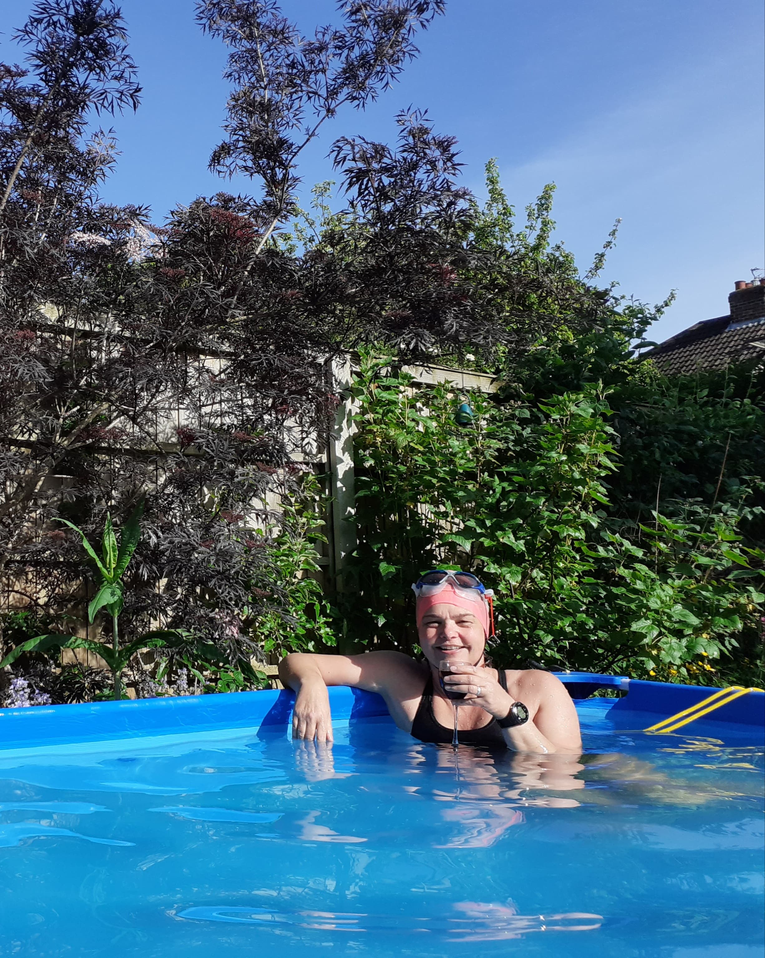 Kristina celebrates with a glass of bubbly at the end of her swim