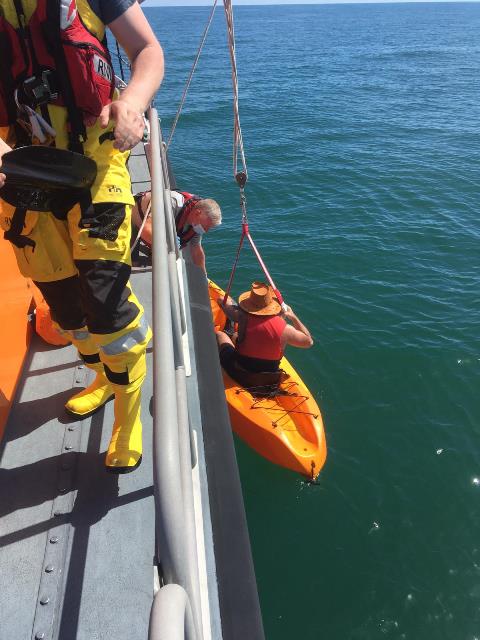 TAKING THE KAYAKER ABOARD