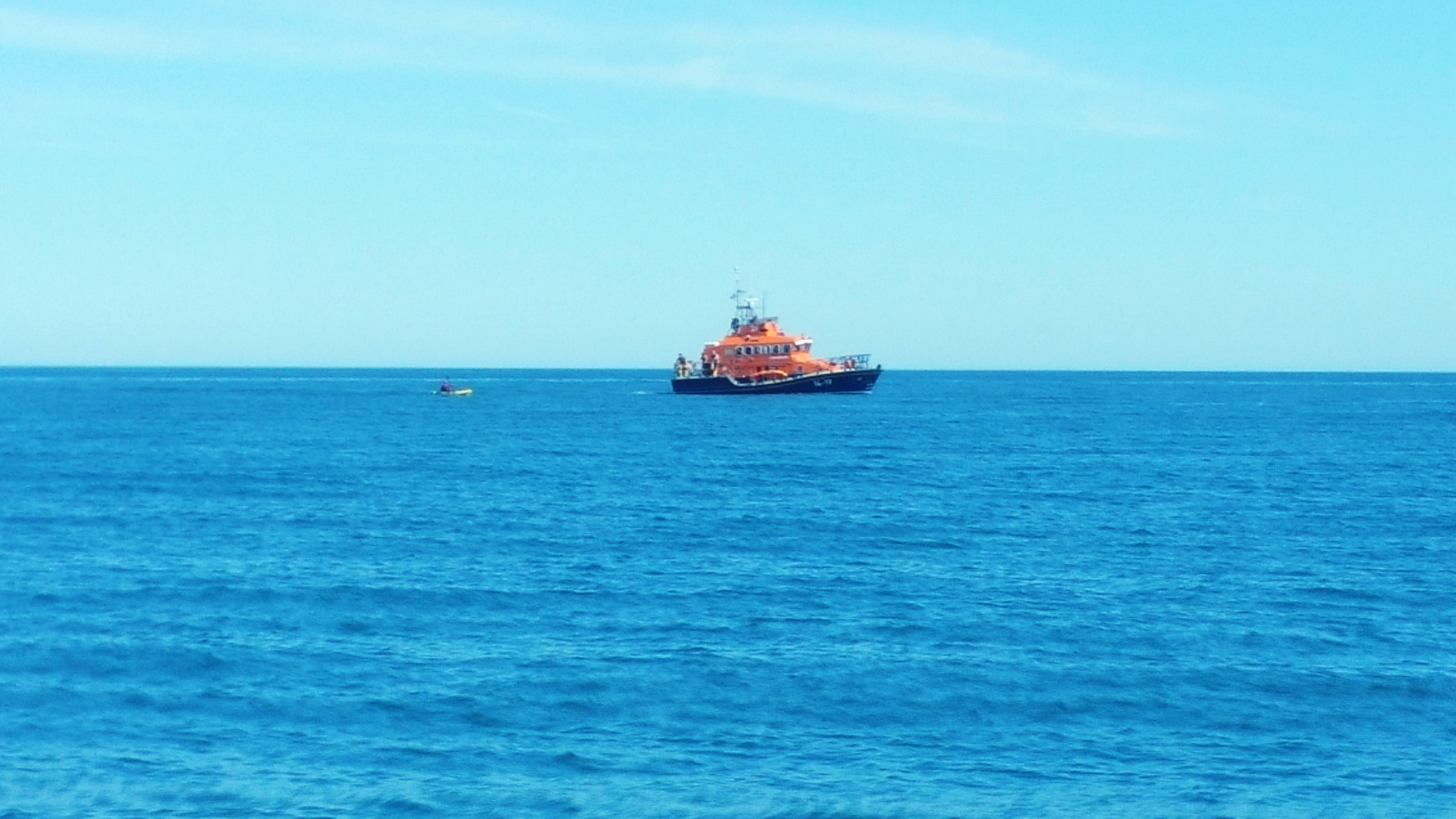 ESCORTING KAYAKER