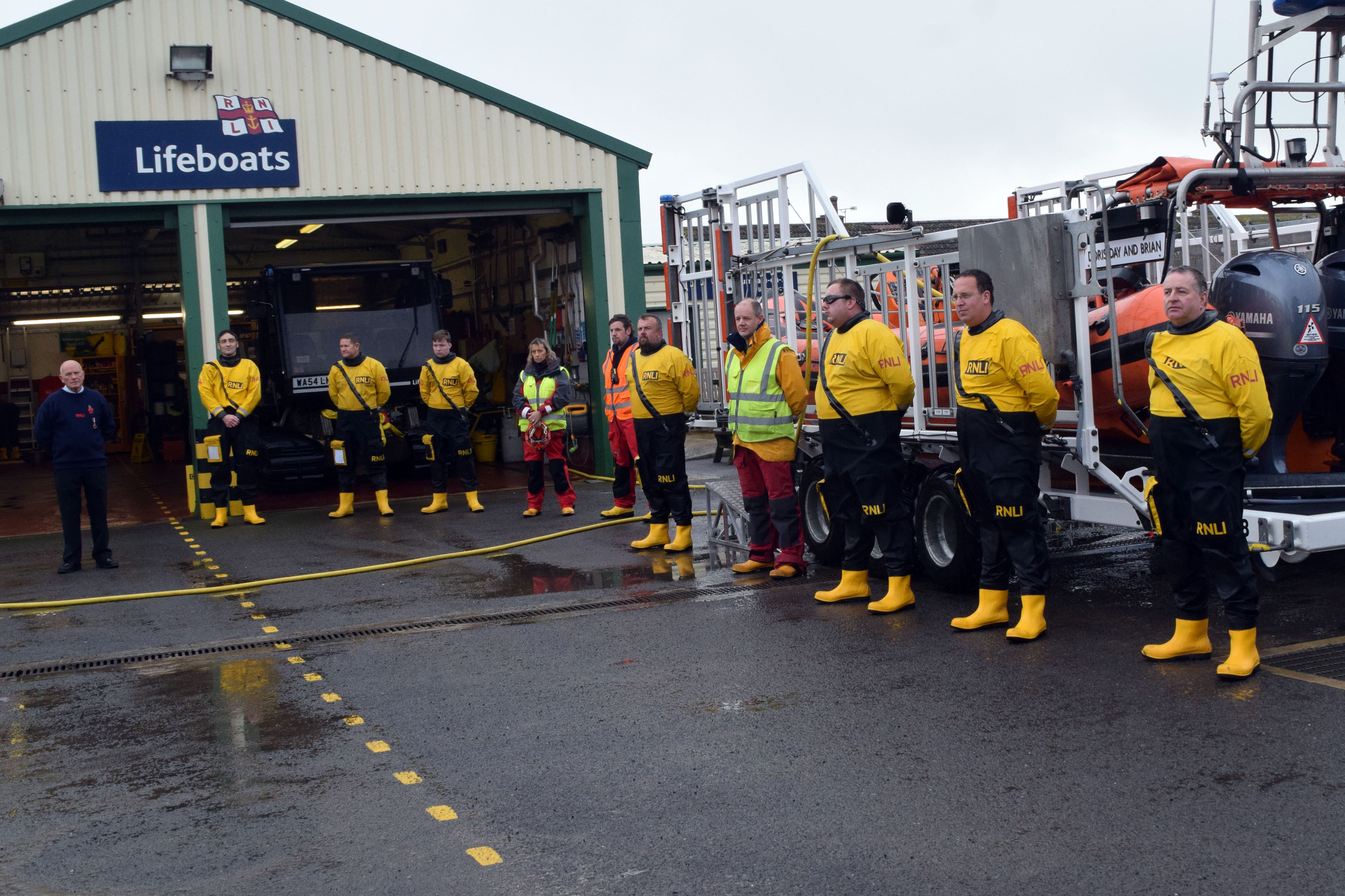 Crewmembers assembled in the station yard