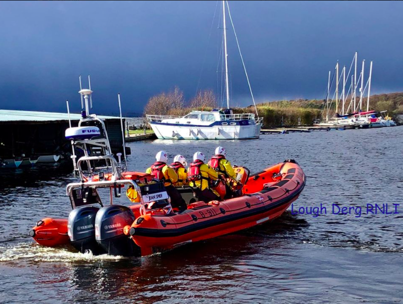 Lough Derg RNLI Lifeboat, photographed from shore heading out on a Shout