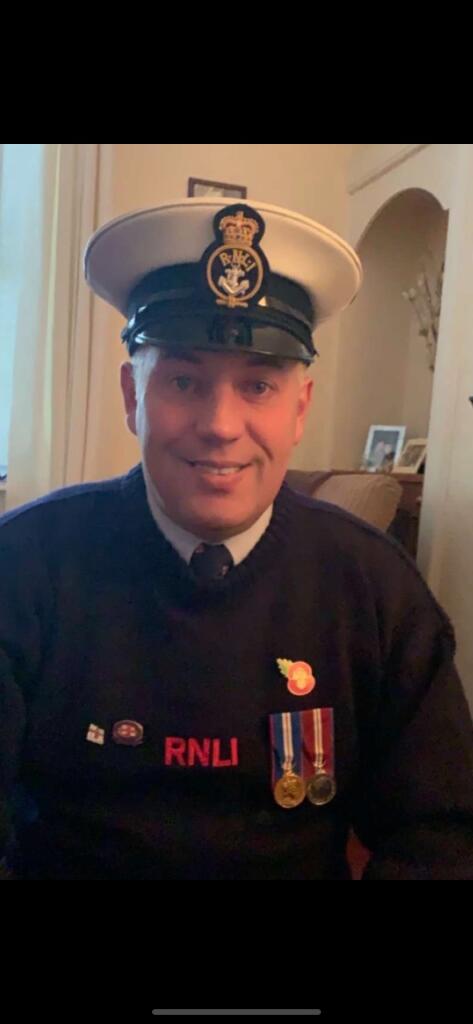 2nd Coxswain Robert Frost receives his 30 year service medal from he RNLI
