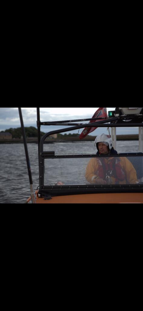 2nd Coxswain Robert Frost at the helm of Berwick-upon-Tweed lifeboat