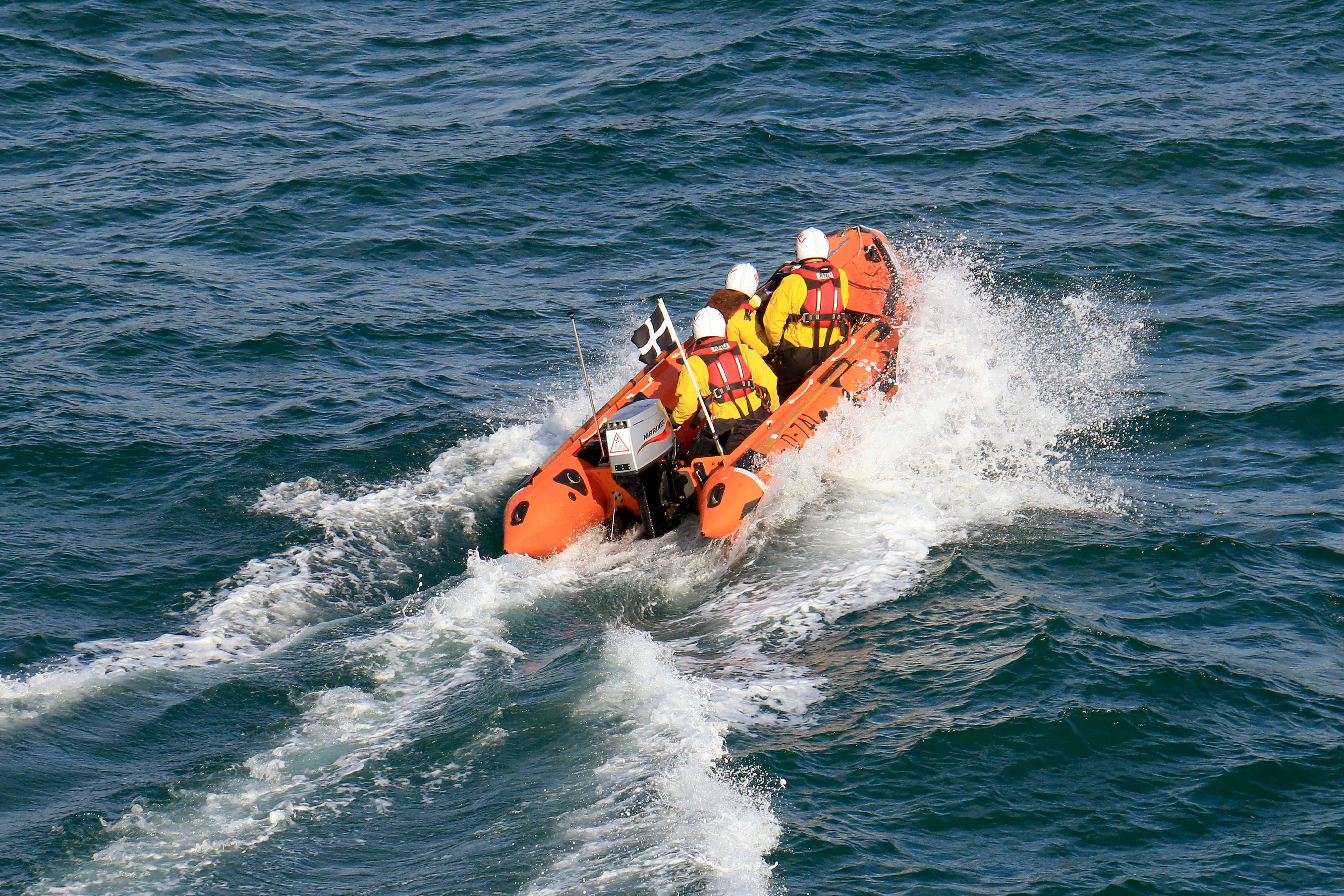 Looe RNLI D Class inshore lifeboat Ollie Naismith launching on service 